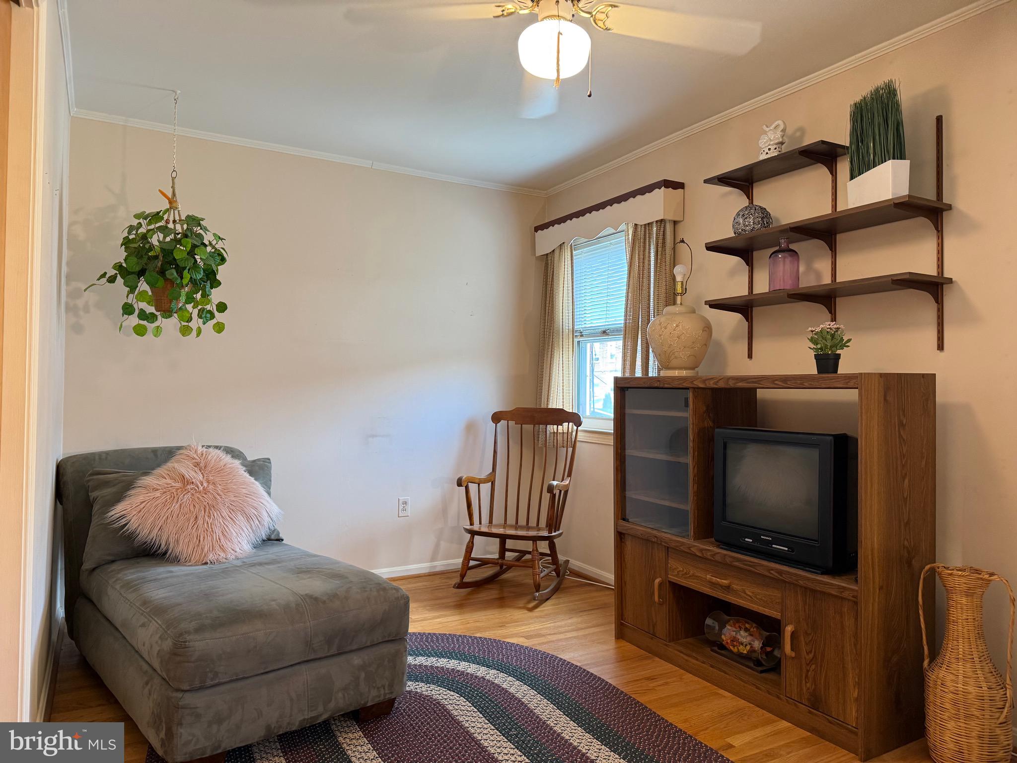 8144 Gray Haven Road Baltimore, MD 21222 - Photo 5 of 37 a living room with furniture and a flat screen tv