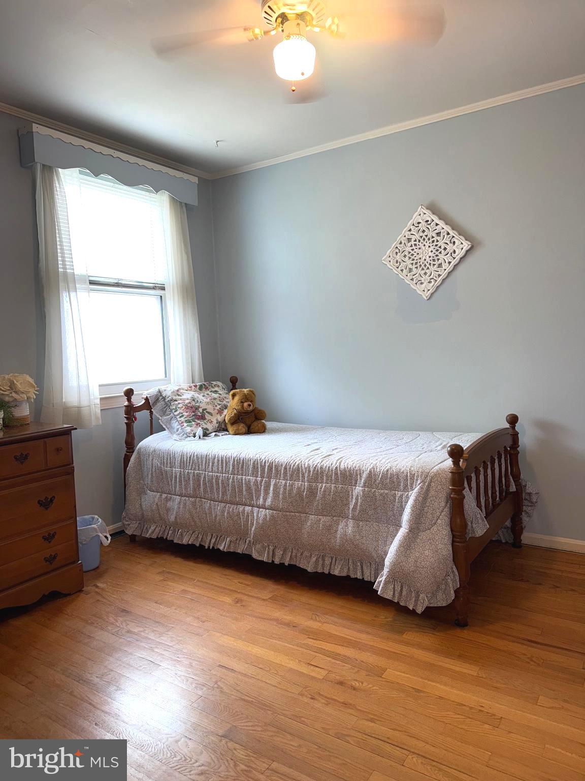 8144 Gray Haven Road Baltimore, MD 21222 - Photo 9 of 37 a bedroom with a bed and a window