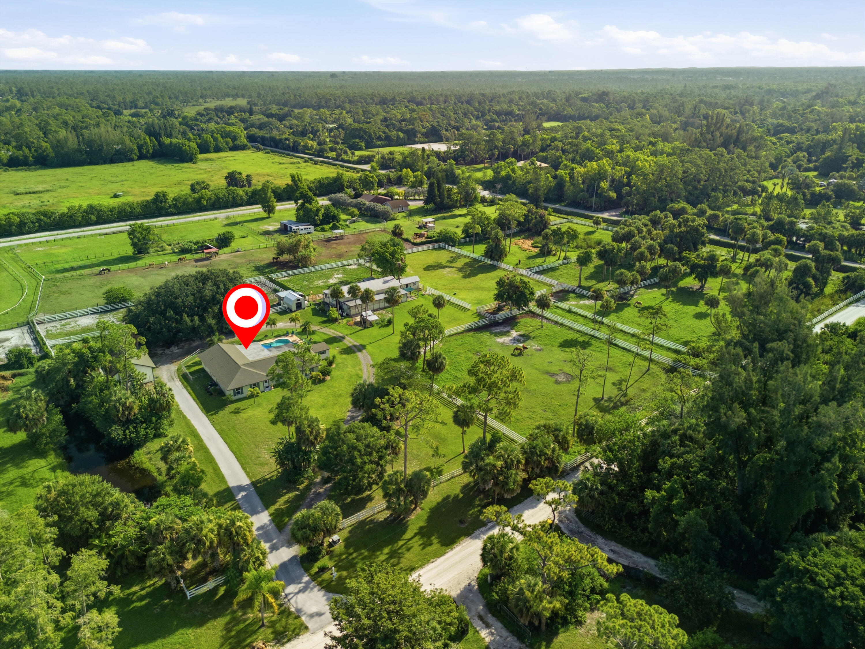 14095 Biddex Road Loxahatchee Groves, FL 33470 - Photo 60 of 69 a view of a green field with lots of flower around