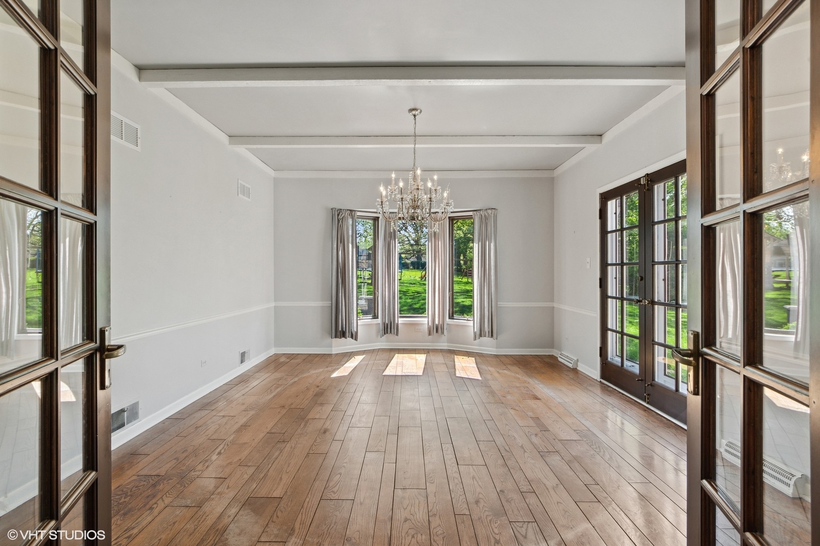 511 Aberdeen Road Frankfort, IL 60423 - Photo 11 of 48 a view of an empty room with wooden floor and a window