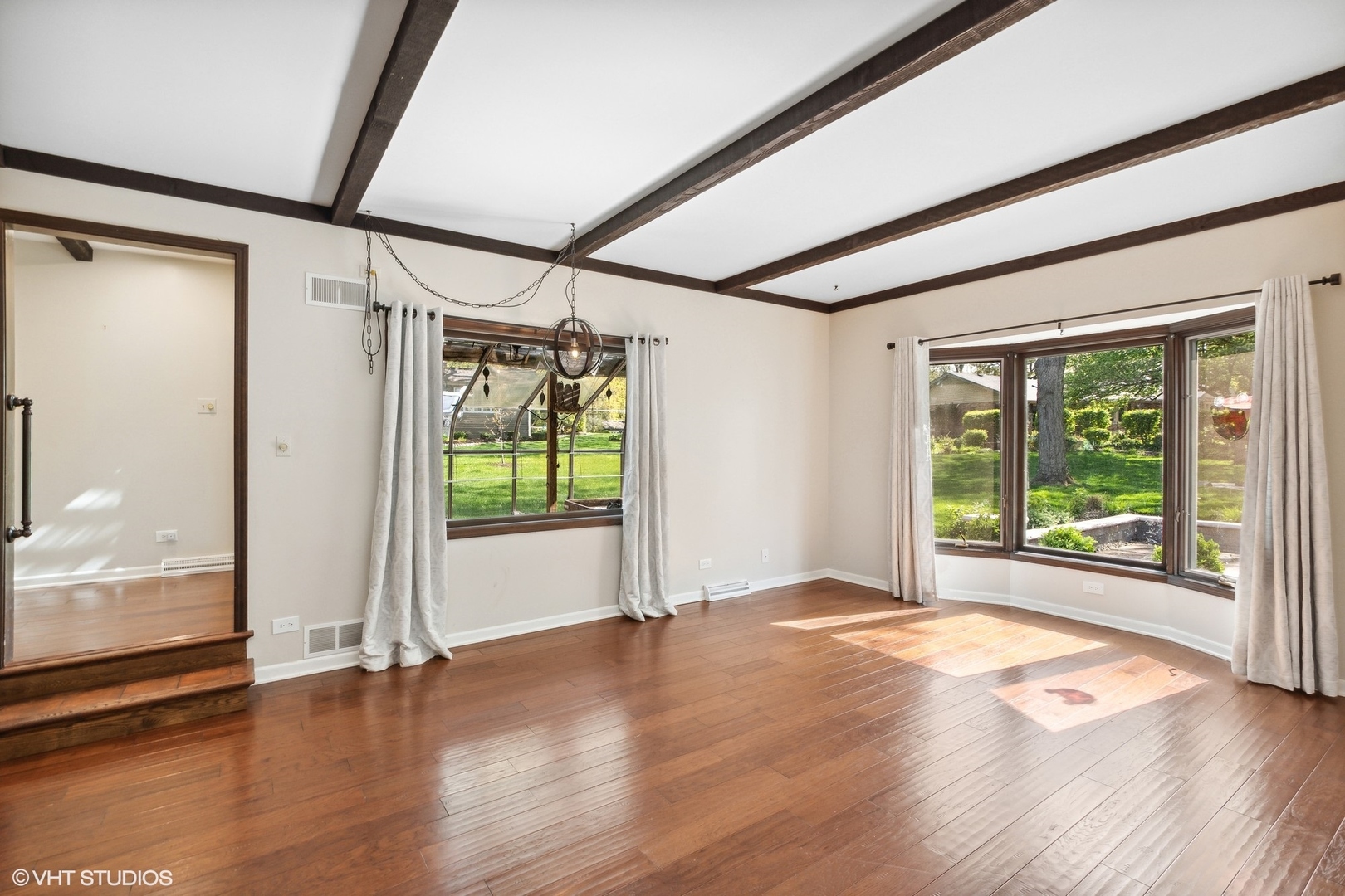 511 Aberdeen Road Frankfort, IL 60423 - Photo 8 of 48 a view of an empty room with wooden floor and a window