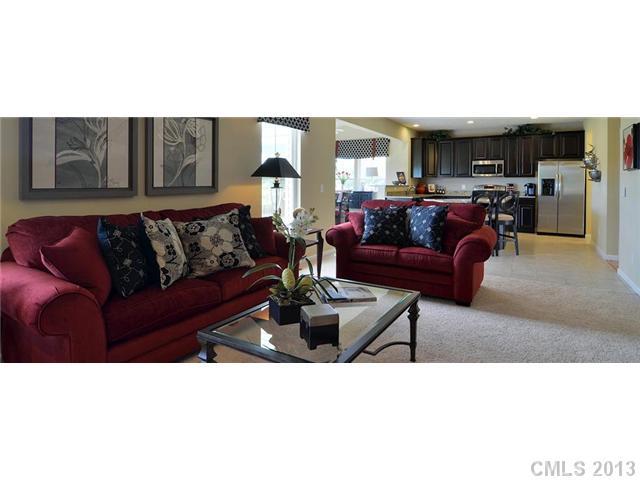 3014 Fallondale Road, Unit 901 Waxhaw, NC 28173 - Photo 1 of 1 a living room with furniture and kitchen view
