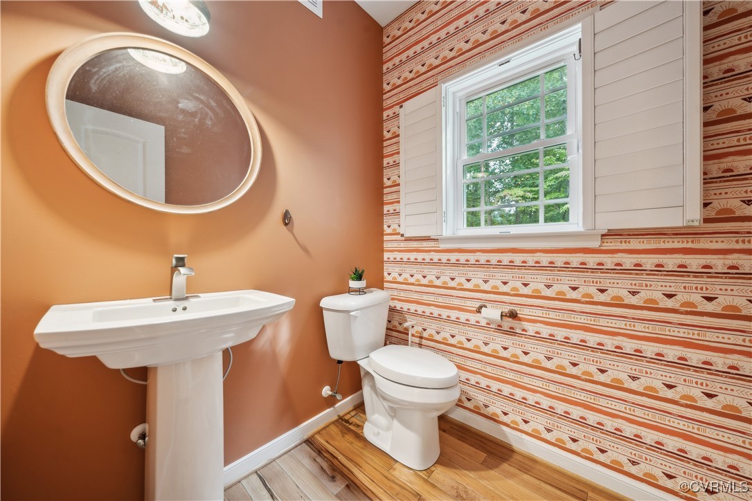 17300 Creekbed Road Chesterfield, VA 23838 - Photo 22 of 49 1st floor powder room with plantation shutters.