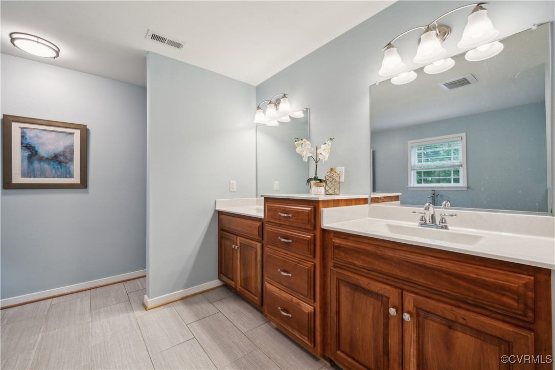 17300 Creekbed Road Chesterfield, VA 23838 - Photo 26 of 49 Dual vanities with extra drawer stack for storage.