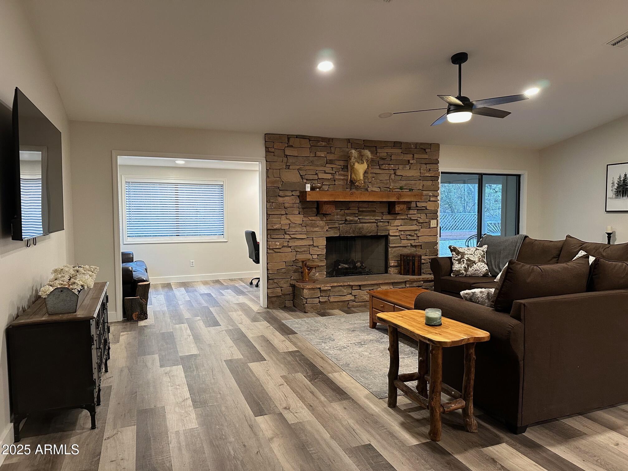 304 North Mogollon Trail Payson, AZ 85541 - Photo 1 of 22 a living room with furniture and a fireplace