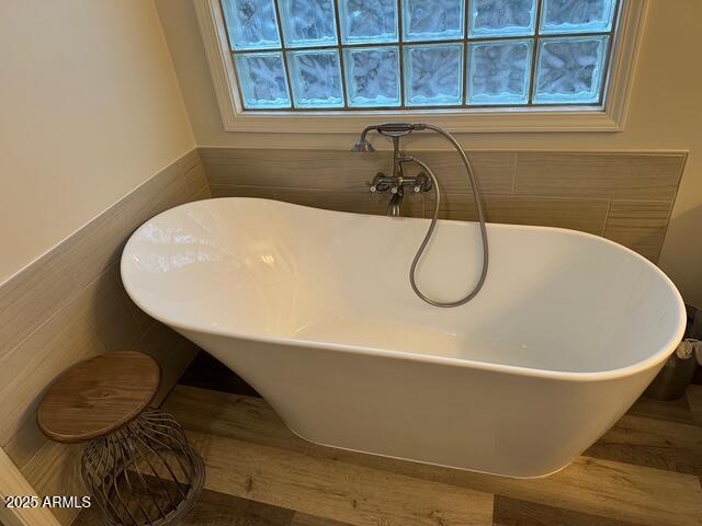 304 North Mogollon Trail Payson, AZ 85541 - Photo 11 of 22 a white bath tub sitting next to a blue sink and a window