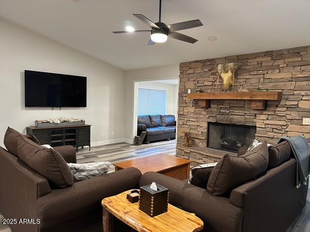 304 North Mogollon Trail Payson, AZ 85541 - Photo 3 of 22 a living room with furniture a fireplace and a flat screen tv