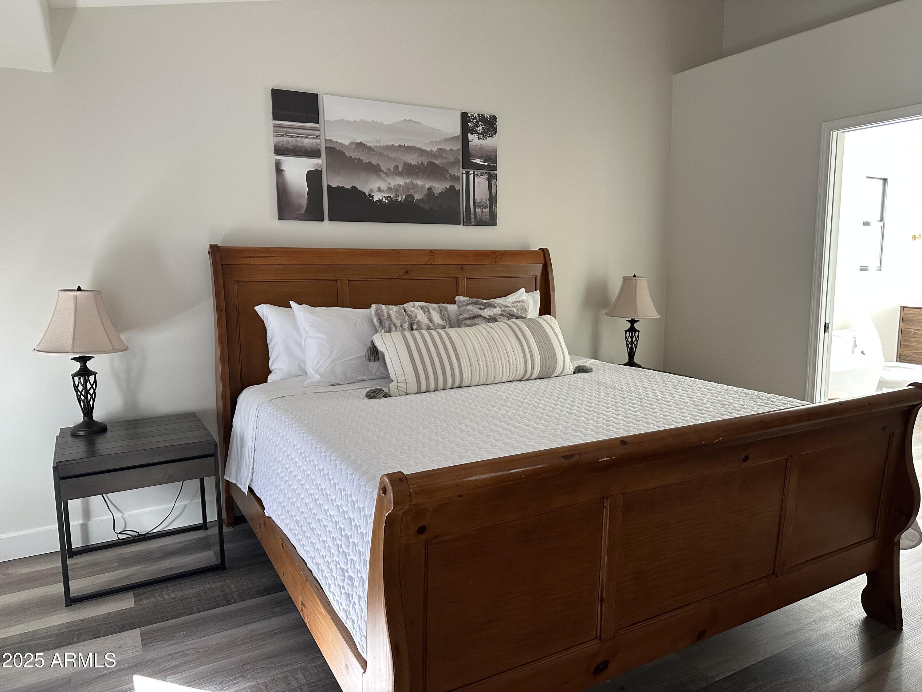 304 North Mogollon Trail Payson, AZ 85541 - Photo 9 of 22 a bedroom with a bed and wooden floor