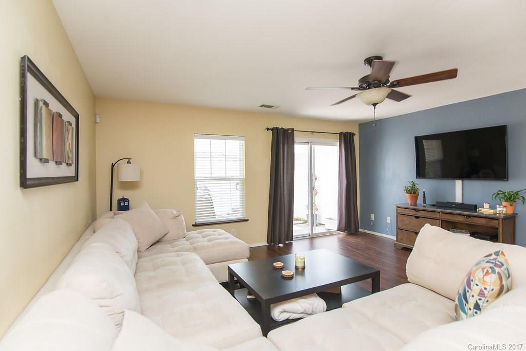 309 River Clay Road, Unit 309 Fort Mill, SC 29708 - Photo 14 of 23 a living room with furniture a flat screen tv and a large window