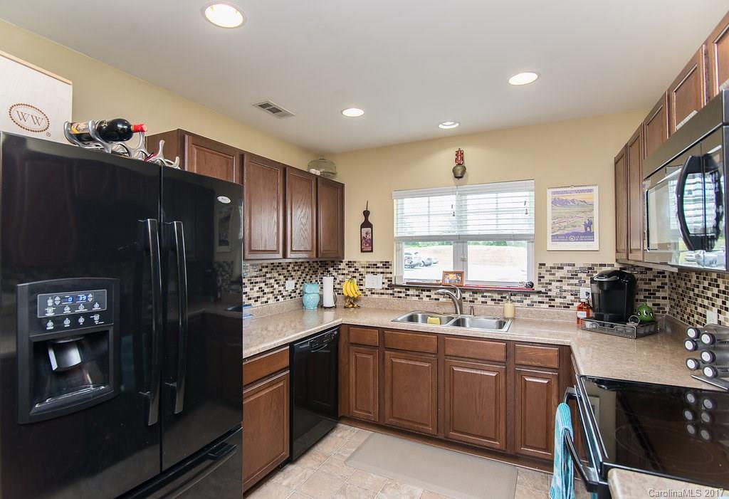 309 River Clay Road, Unit 309 Fort Mill, SC 29708 - Photo 3 of 23 a kitchen with a sink stove and refrigerator