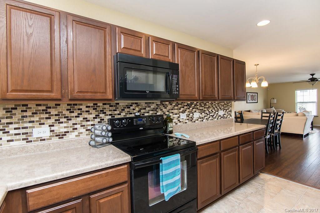 309 River Clay Road, Unit 309 Fort Mill, SC 29708 - Photo 4 of 23 a kitchen with a sink stove and microwave