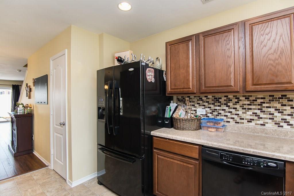 309 River Clay Road, Unit 309 Fort Mill, SC 29708 - Photo 5 of 23 a kitchen with a refrigerator and a sink