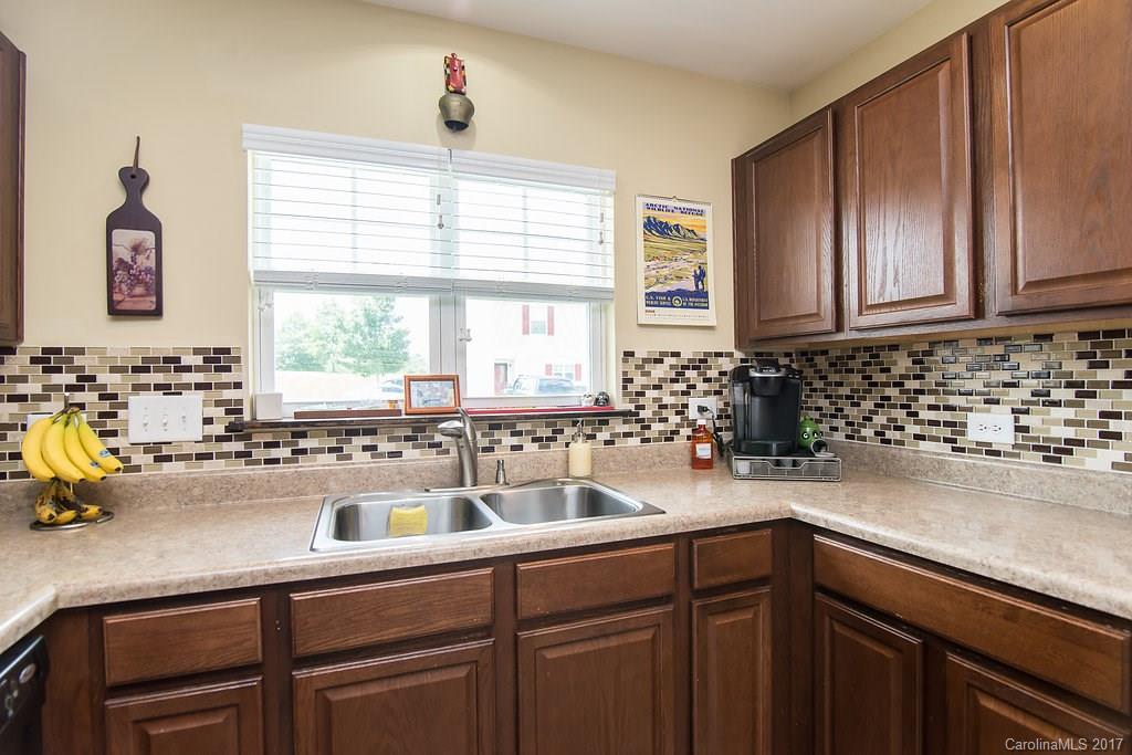 309 River Clay Road, Unit 309 Fort Mill, SC 29708 - Photo 6 of 23 a kitchen with a sink and a window