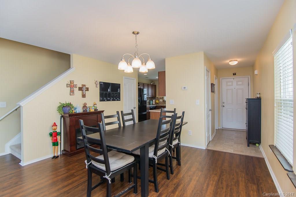 309 River Clay Road, Unit 309 Fort Mill, SC 29708 - Photo 7 of 23 a view of a dining room with furniture and wooden floor