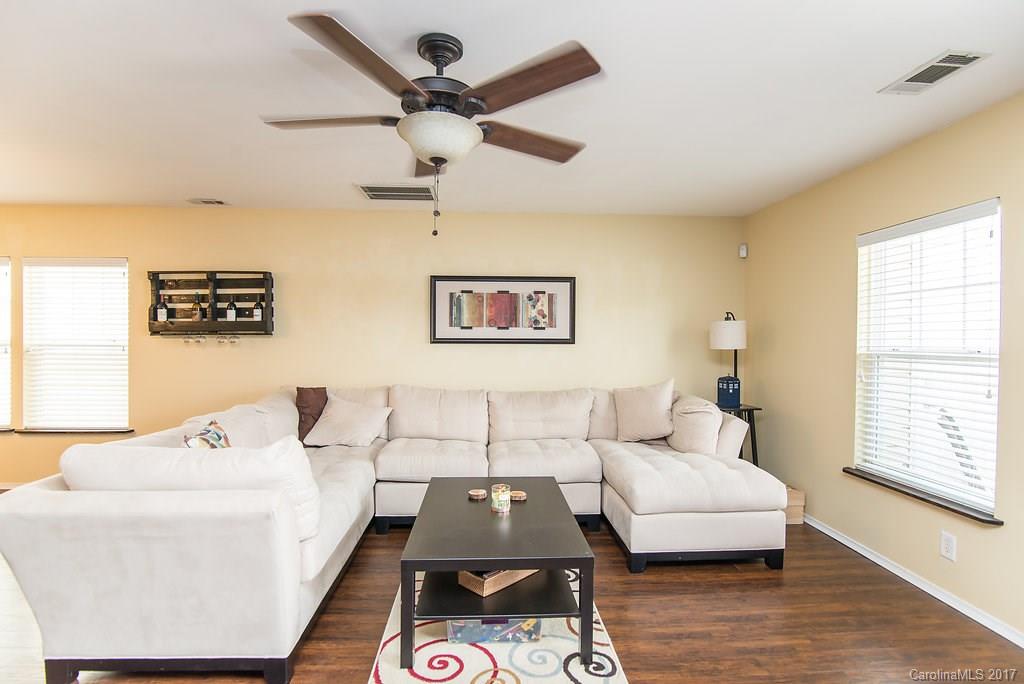 309 River Clay Road, Unit 309 Fort Mill, SC 29708 - Photo 10 of 23 a living room with furniture and a wooden floor