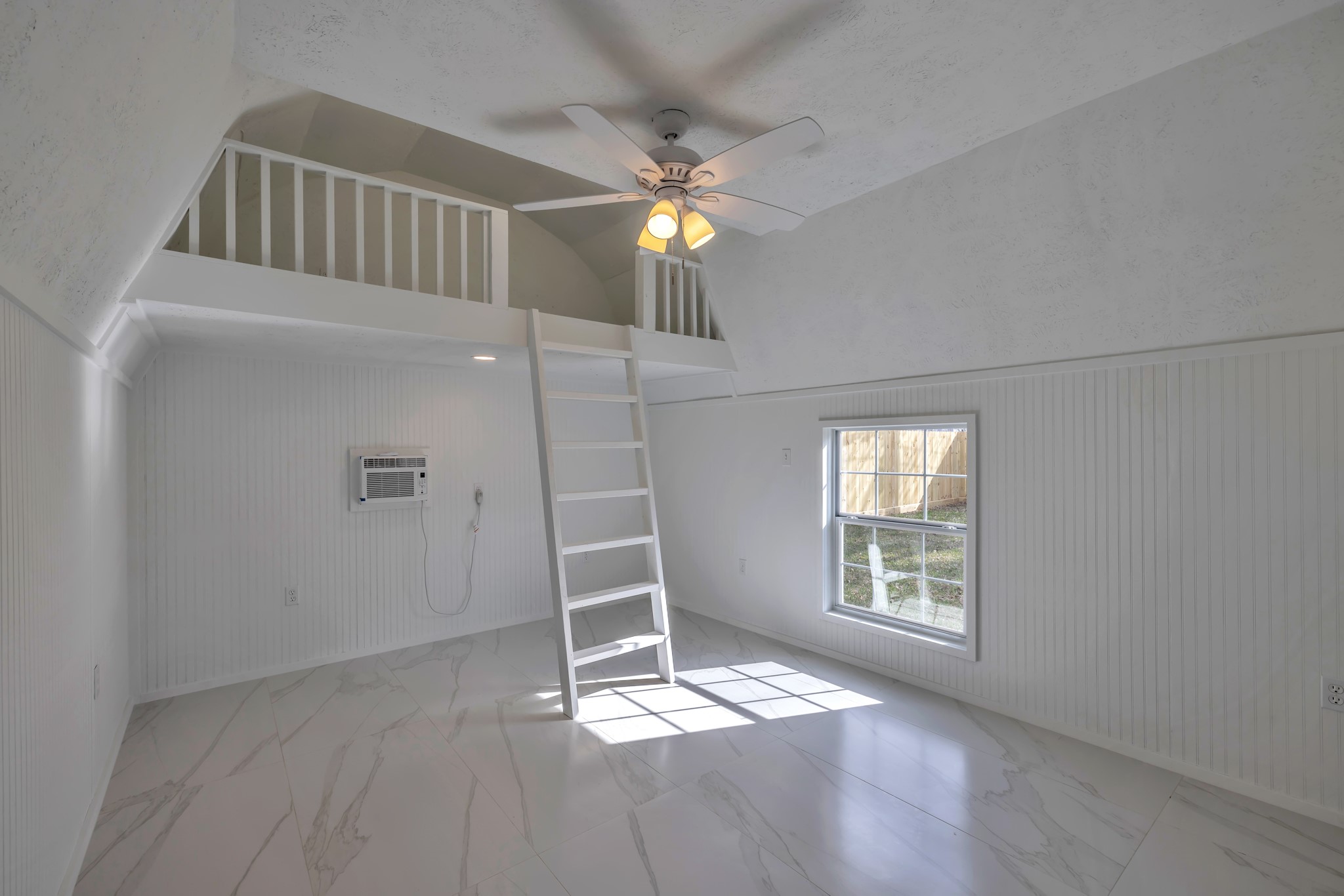 8709 Tarbell Road Houston, TX 77034 - Photo 23 of 25 an empty room with windows and ceiling fan