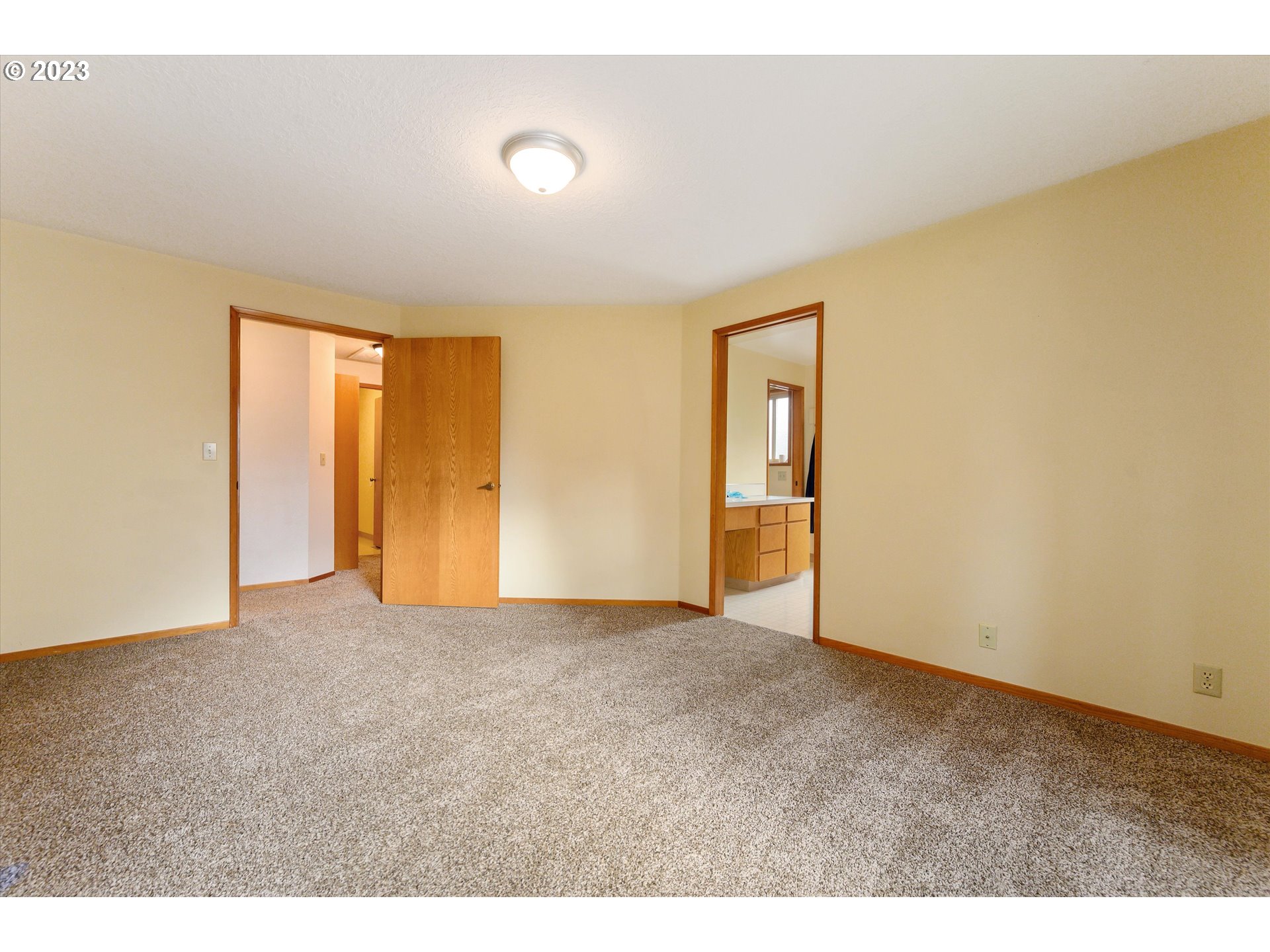 1811 D Street Forest Grove, OR 97116 - Photo 23 of 34 a view of an empty room with wooden floor and a window