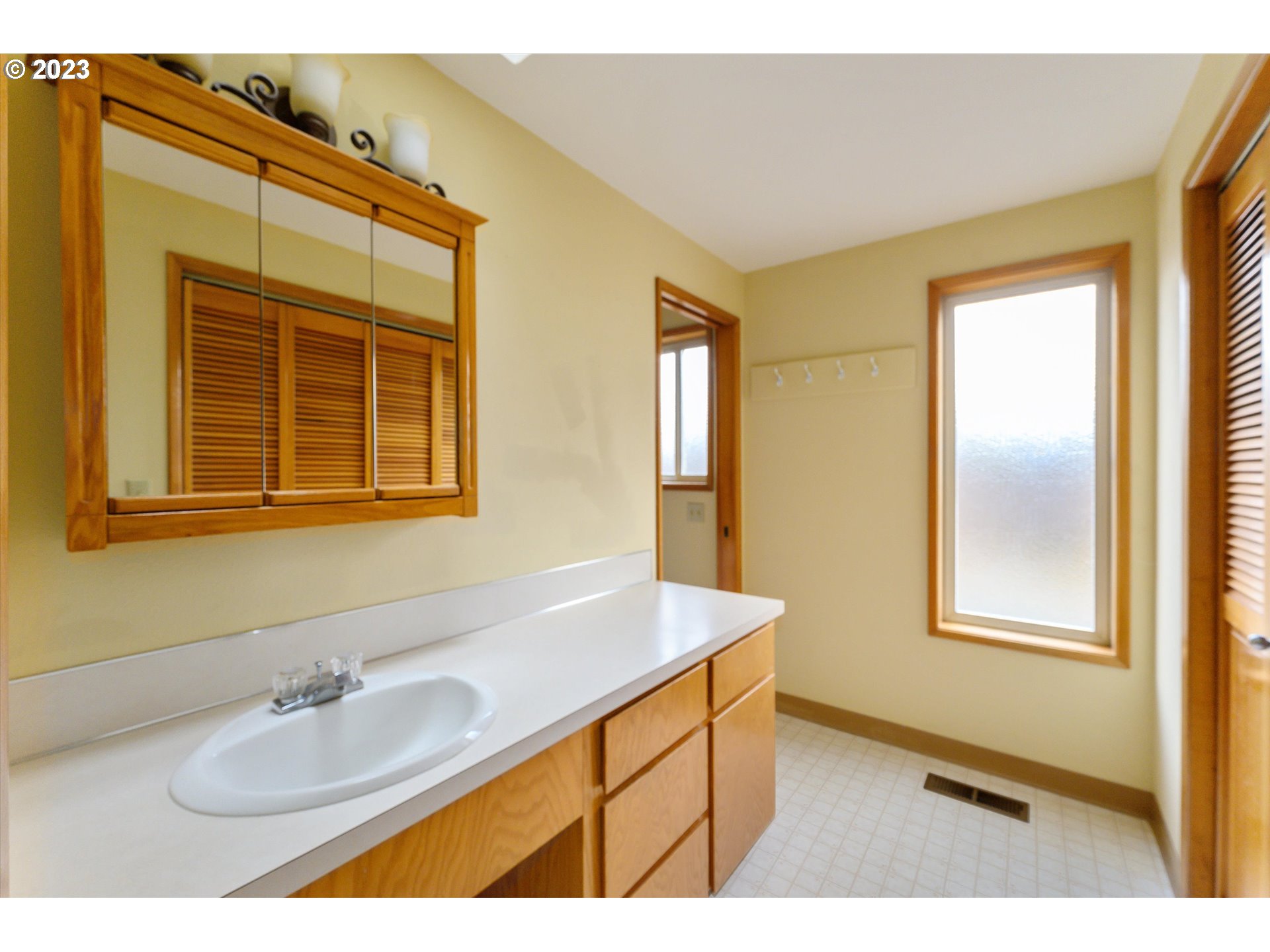 1811 D Street Forest Grove, OR 97116 - Photo 24 of 34 a bathroom with a sink and a mirror