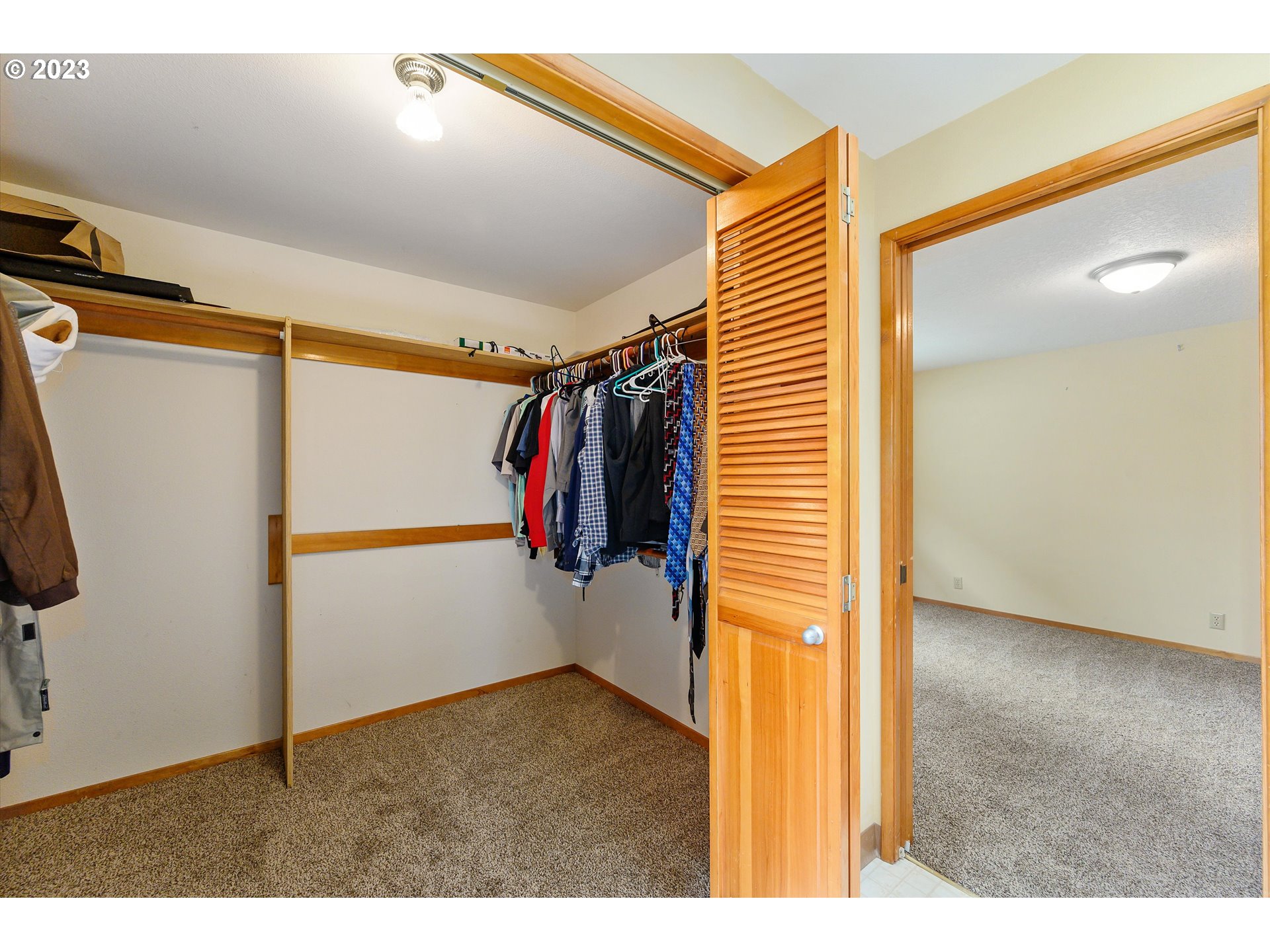 1811 D Street Forest Grove, OR 97116 - Photo 25 of 34 a view of walk in closet with clothes and shoes
