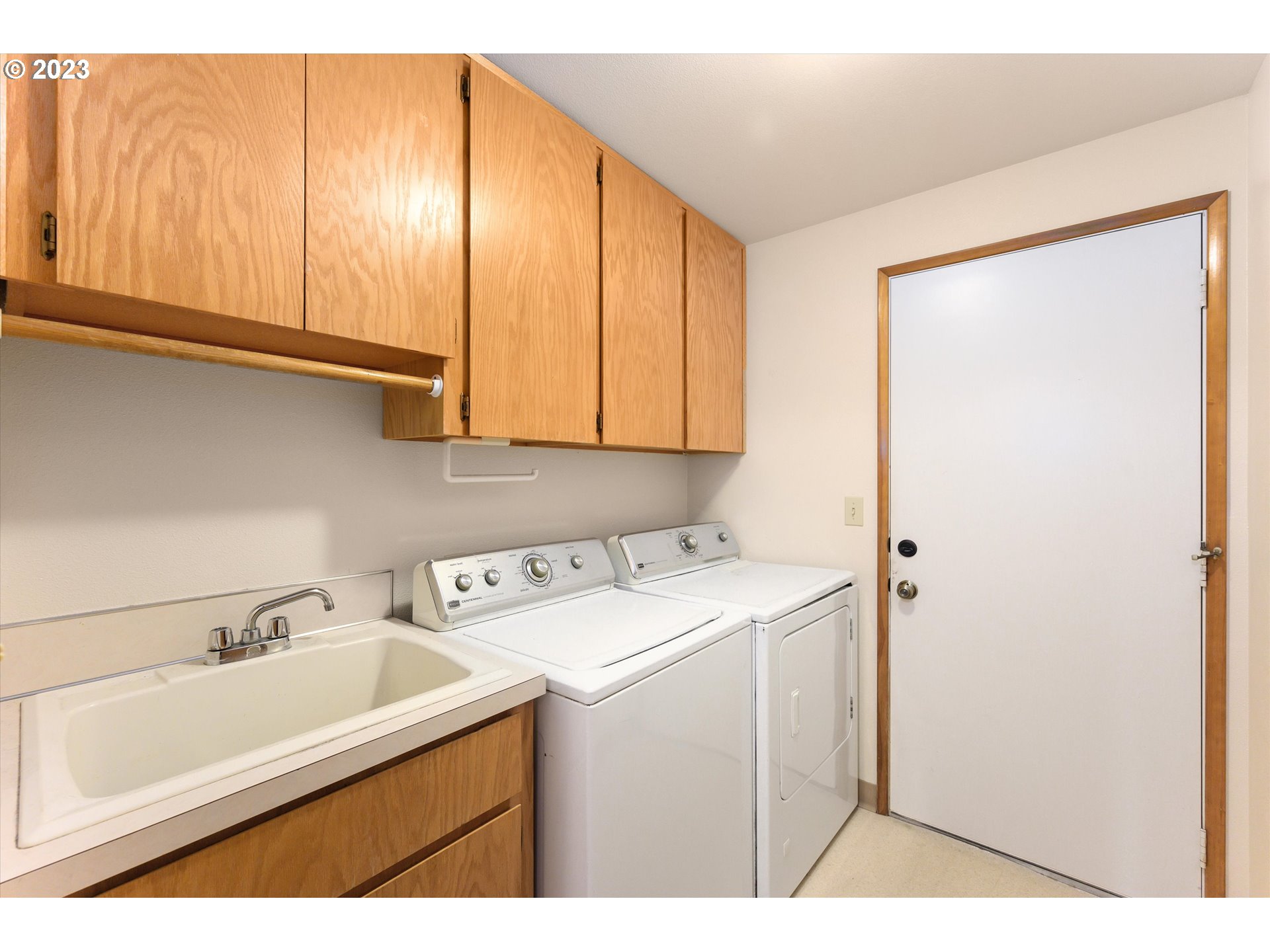 1811 D Street Forest Grove, OR 97116 - Photo 30 of 34 a utility room with a sink washer and dryer