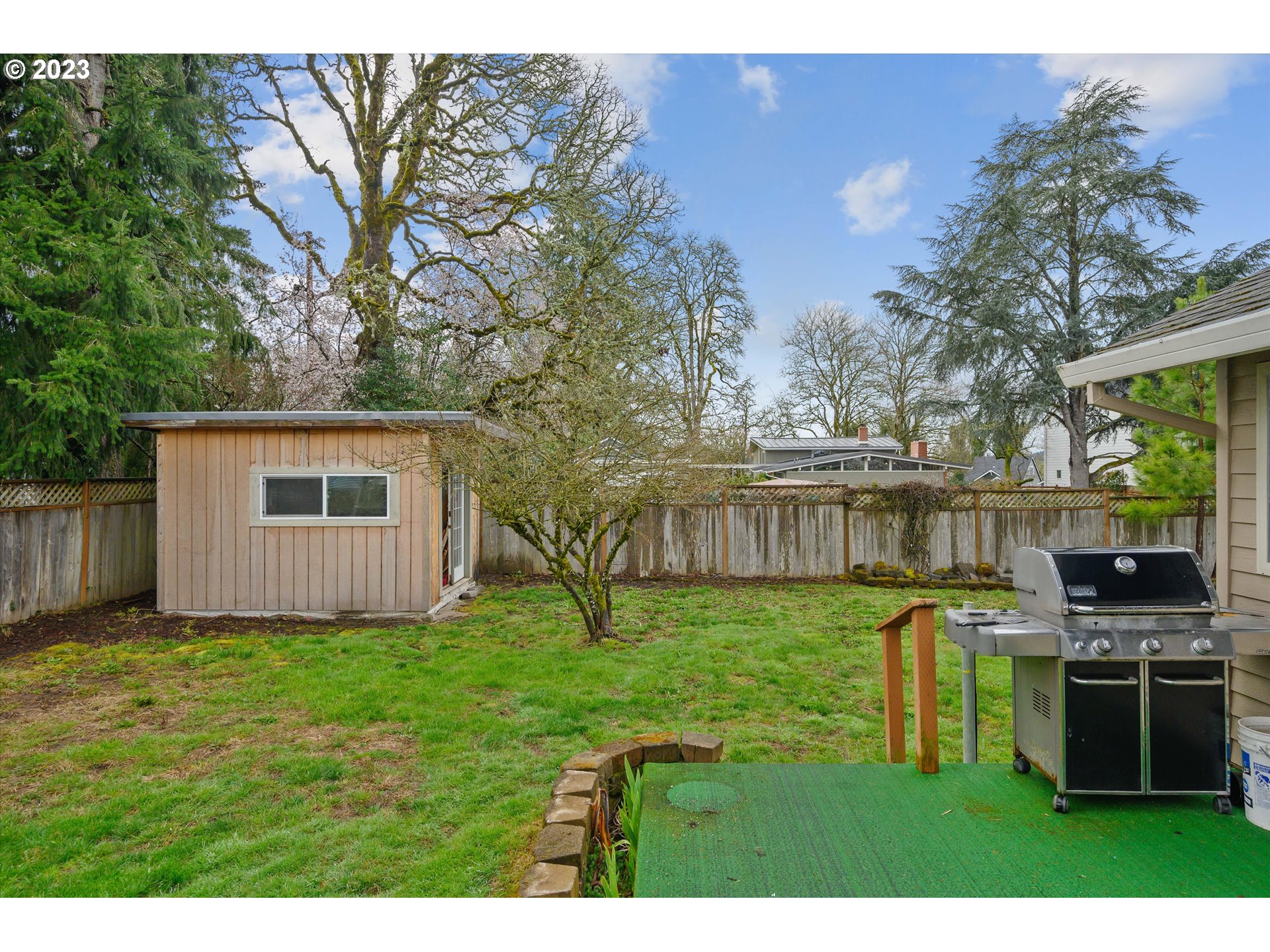 1811 D Street Forest Grove, OR 97116 - Photo 32 of 34 a backyard of a house with table and chairs