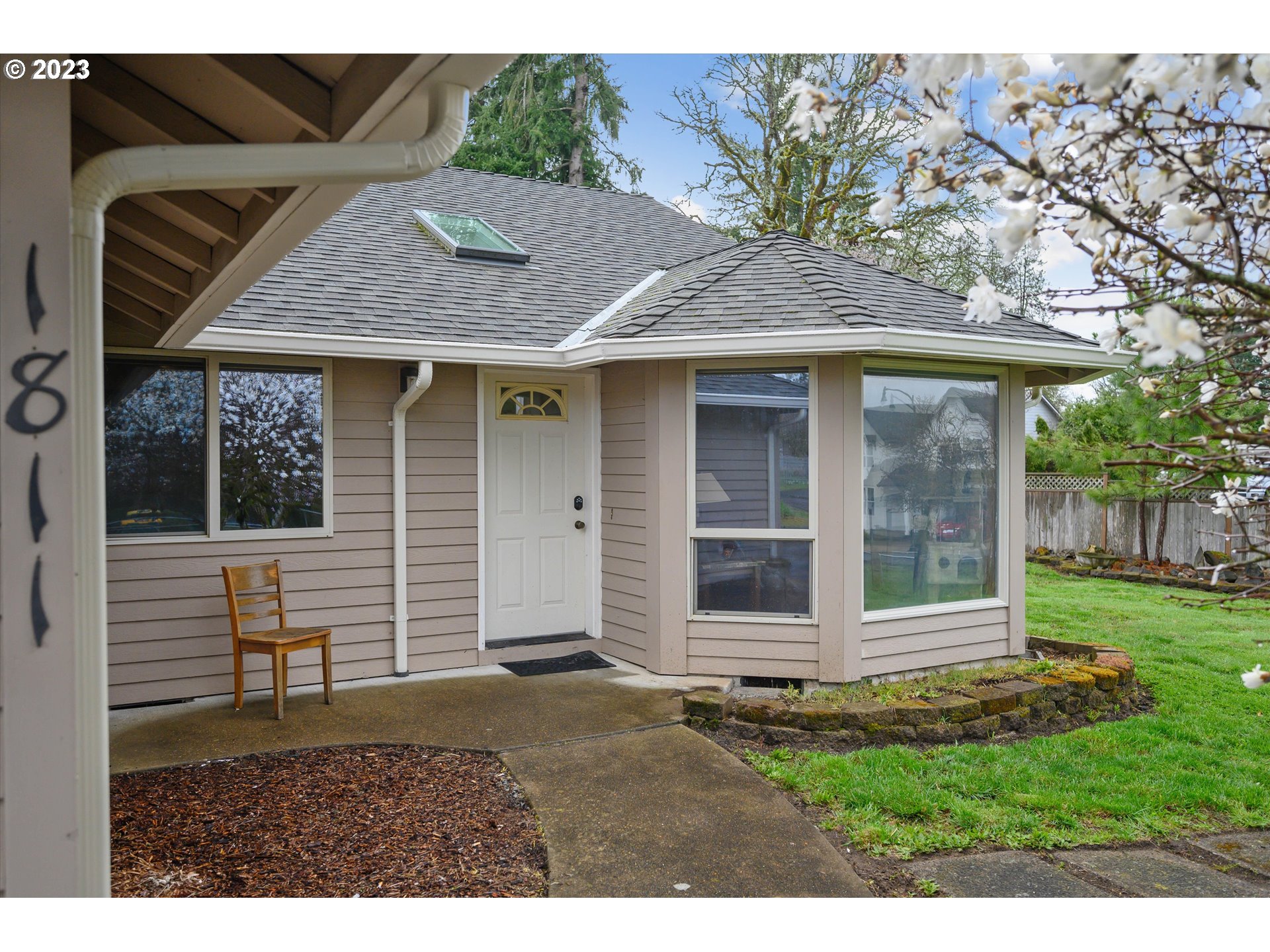 1811 D Street Forest Grove, OR 97116 - Photo 5 of 34 a front view of a house with a garden