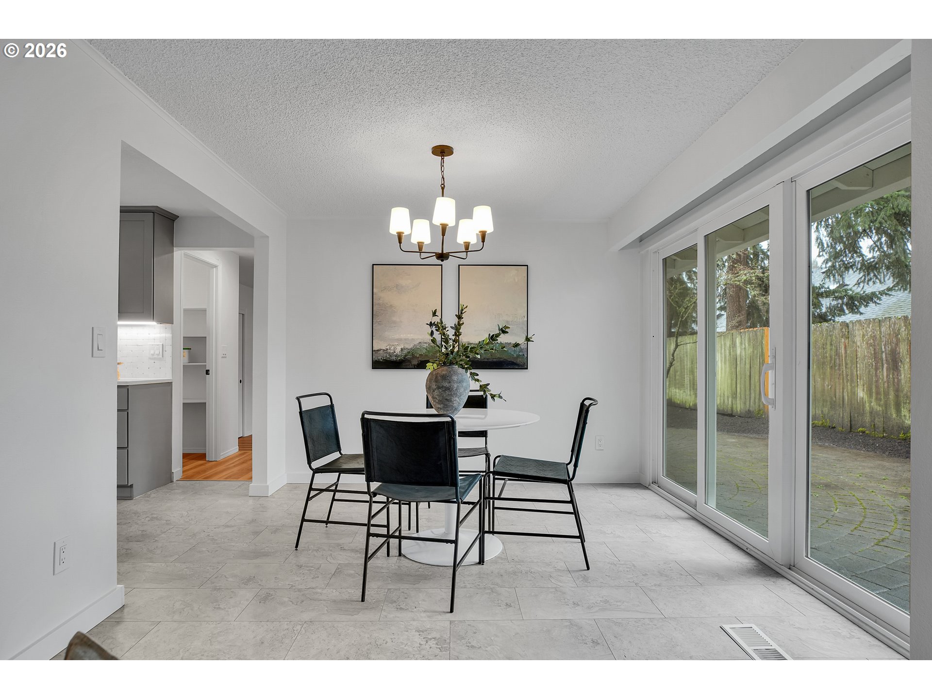 20332 Southwest Rock Court Beaverton, OR 97003 - Photo 11 of 47 a dining room with furniture a chandelier and wooden floor