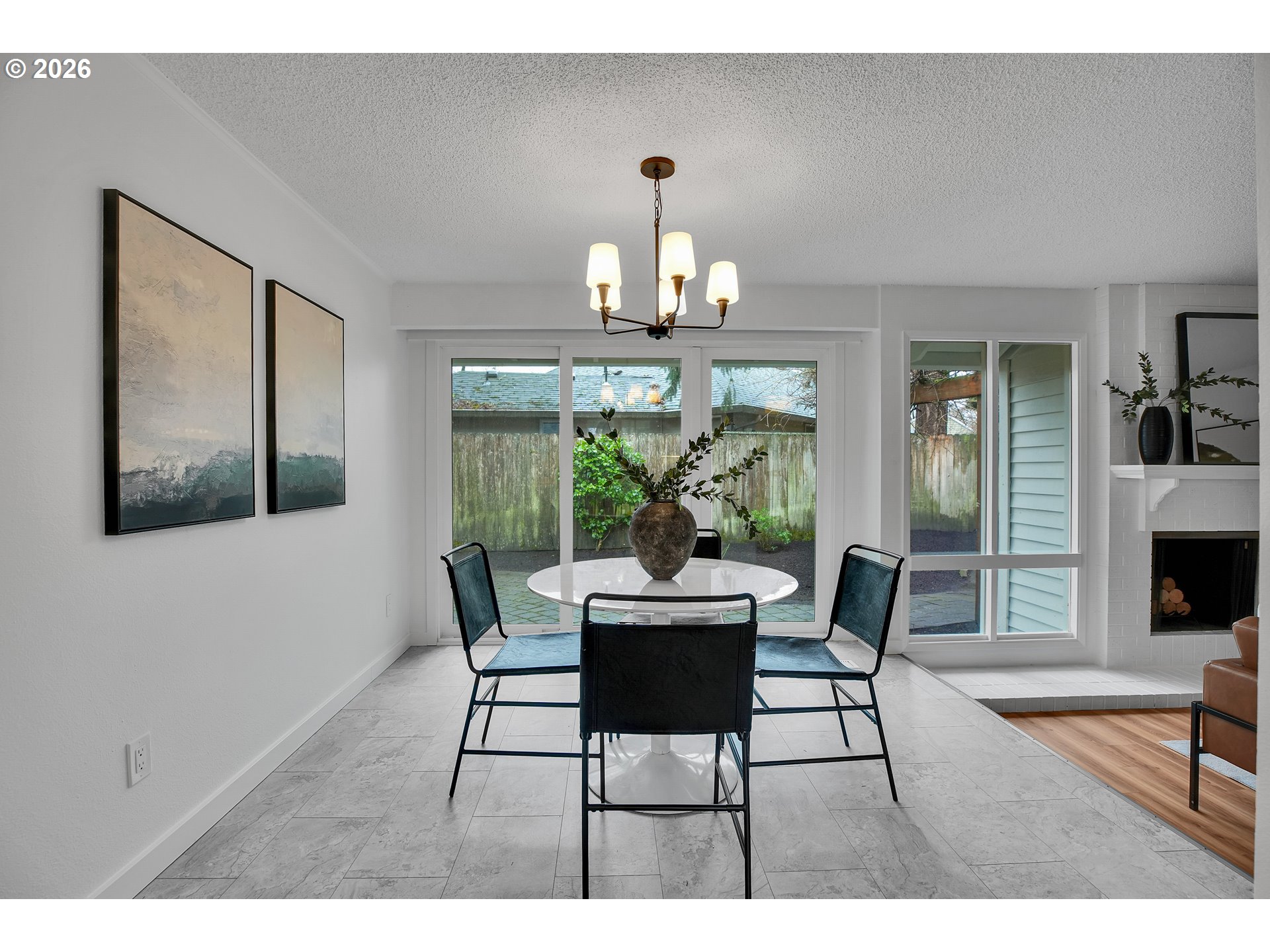 20332 Southwest Rock Court Beaverton, OR 97003 - Photo 13 of 47 a dining room with wooden floor a glass table and chairs