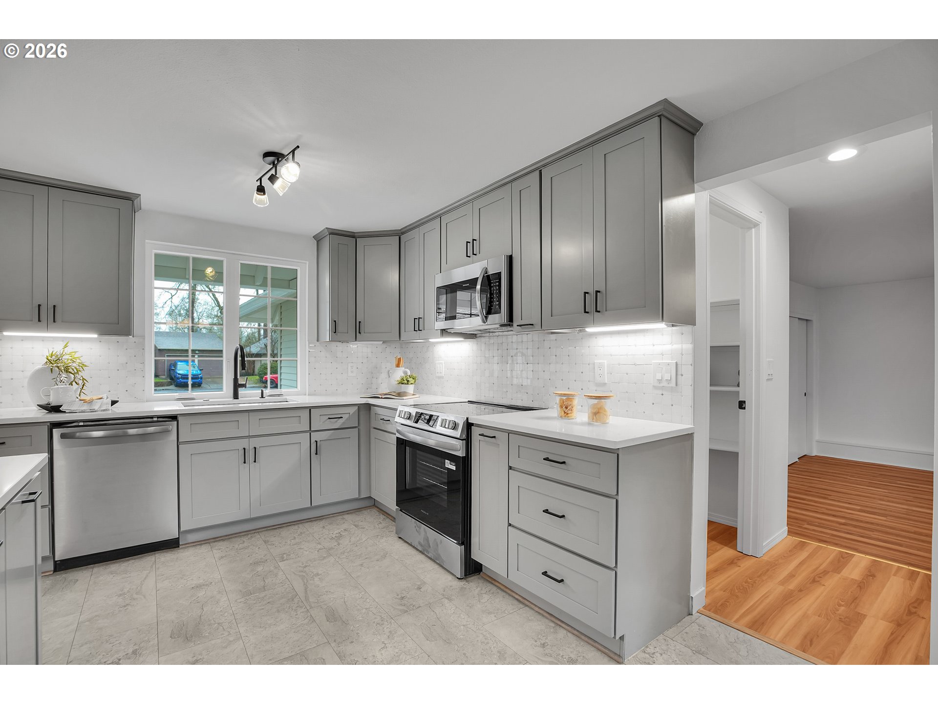 20332 Southwest Rock Court Beaverton, OR 97003 - Photo 15 of 47 a kitchen with granite countertop cabinets stainless steel appliances and a window