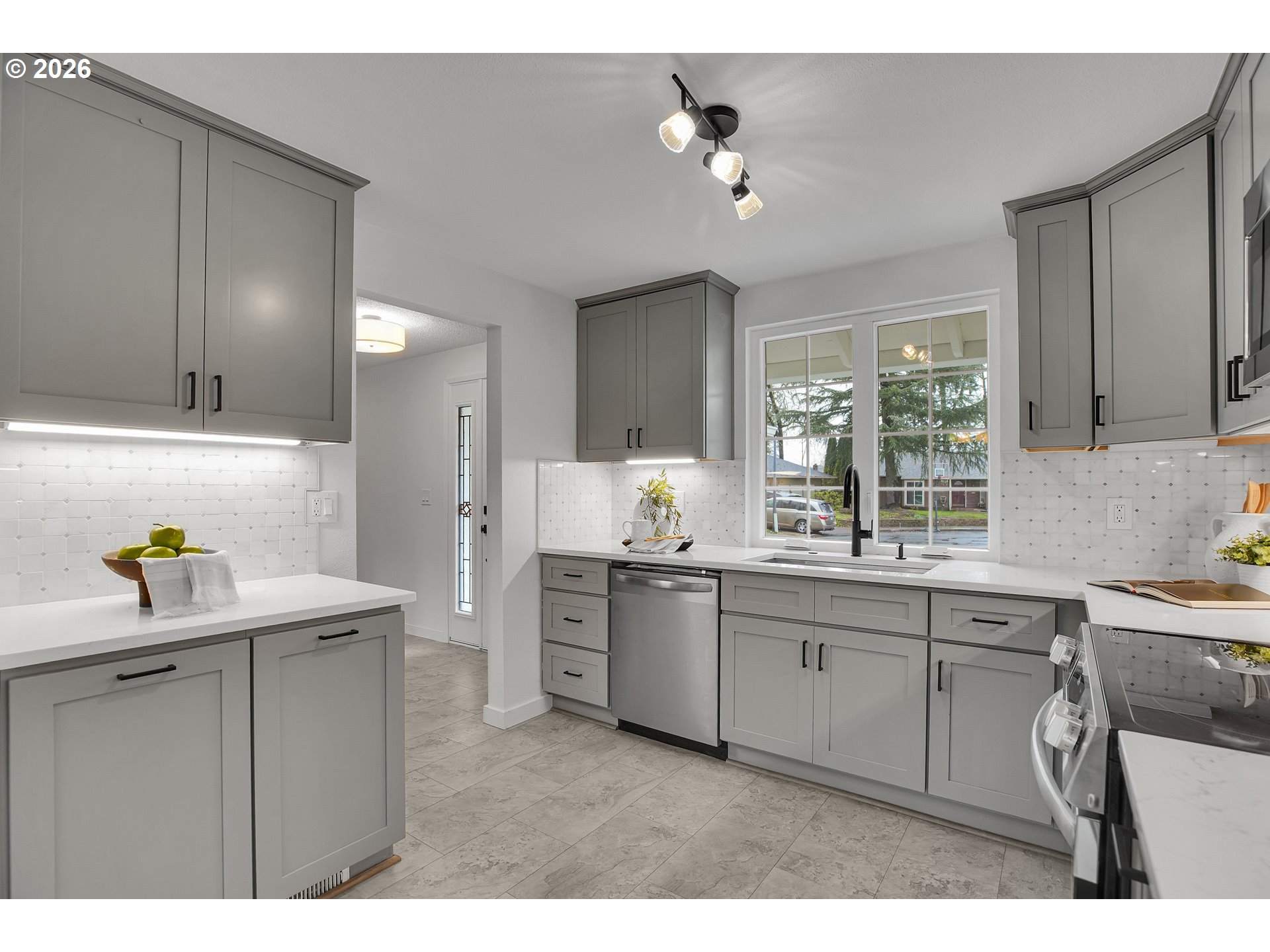 20332 Southwest Rock Court Beaverton, OR 97003 - Photo 18 of 47 a kitchen with a sink cabinets and appliances