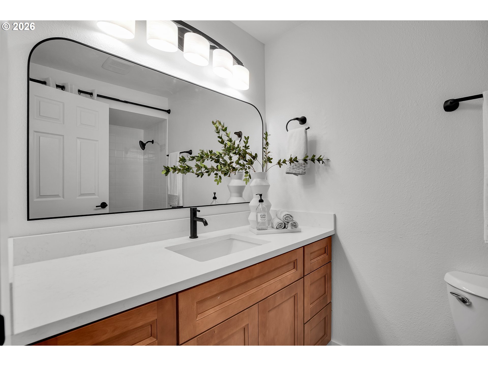 20332 Southwest Rock Court Beaverton, OR 97003 - Photo 27 of 47 a bathroom with a sink and a mirror