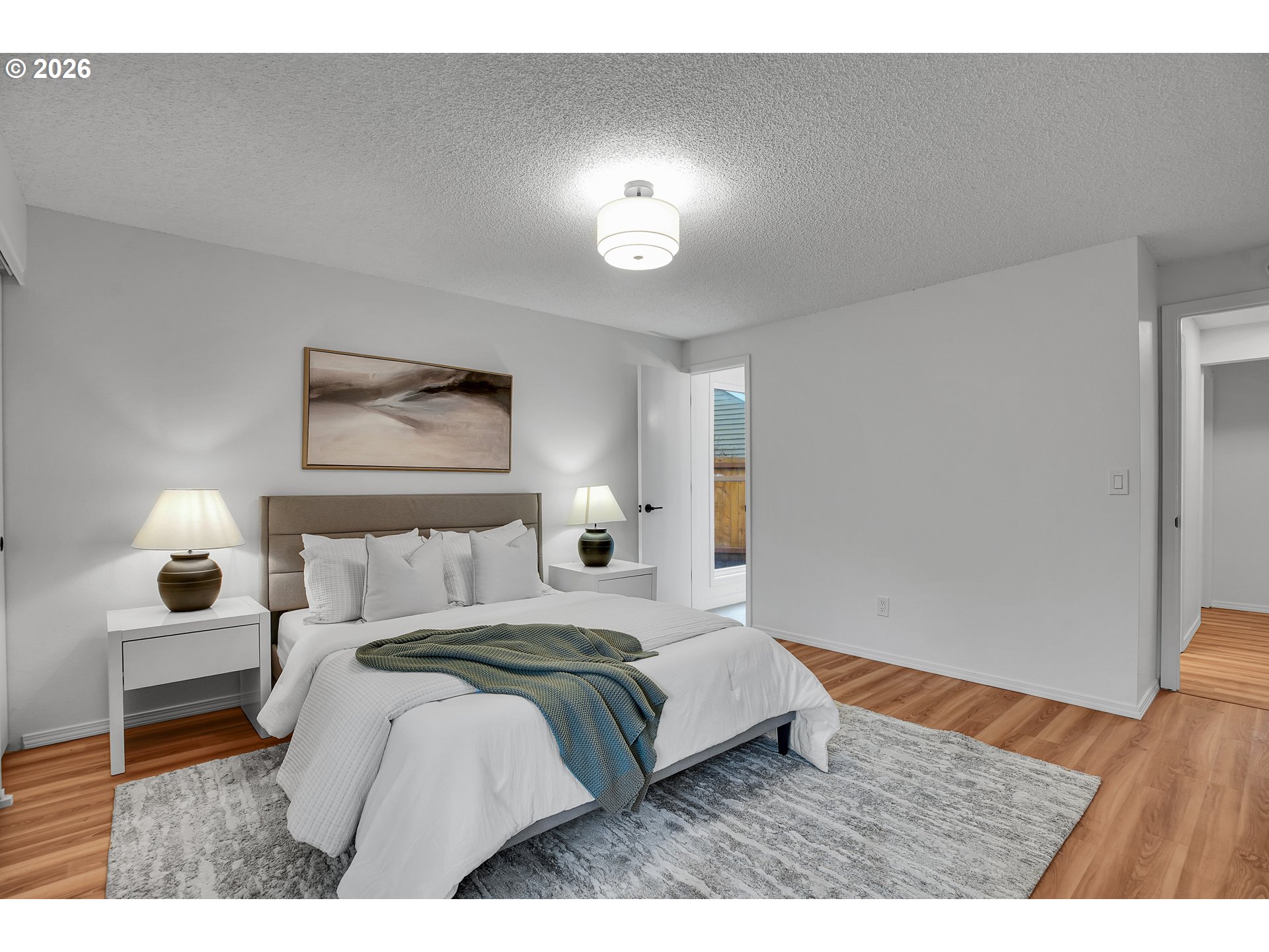 20332 Southwest Rock Court Beaverton, OR 97003 - Photo 31 of 47 a bedroom with a bed and a lamp