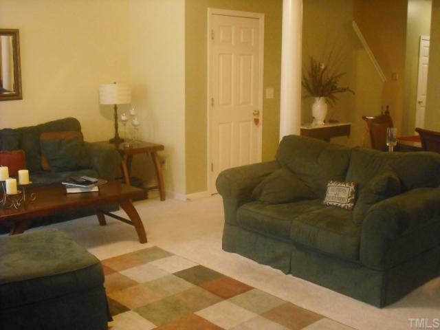 504 Erie Road Raleigh, NC 27610 - Photo 4 of 4 a living room with furniture and a lamp