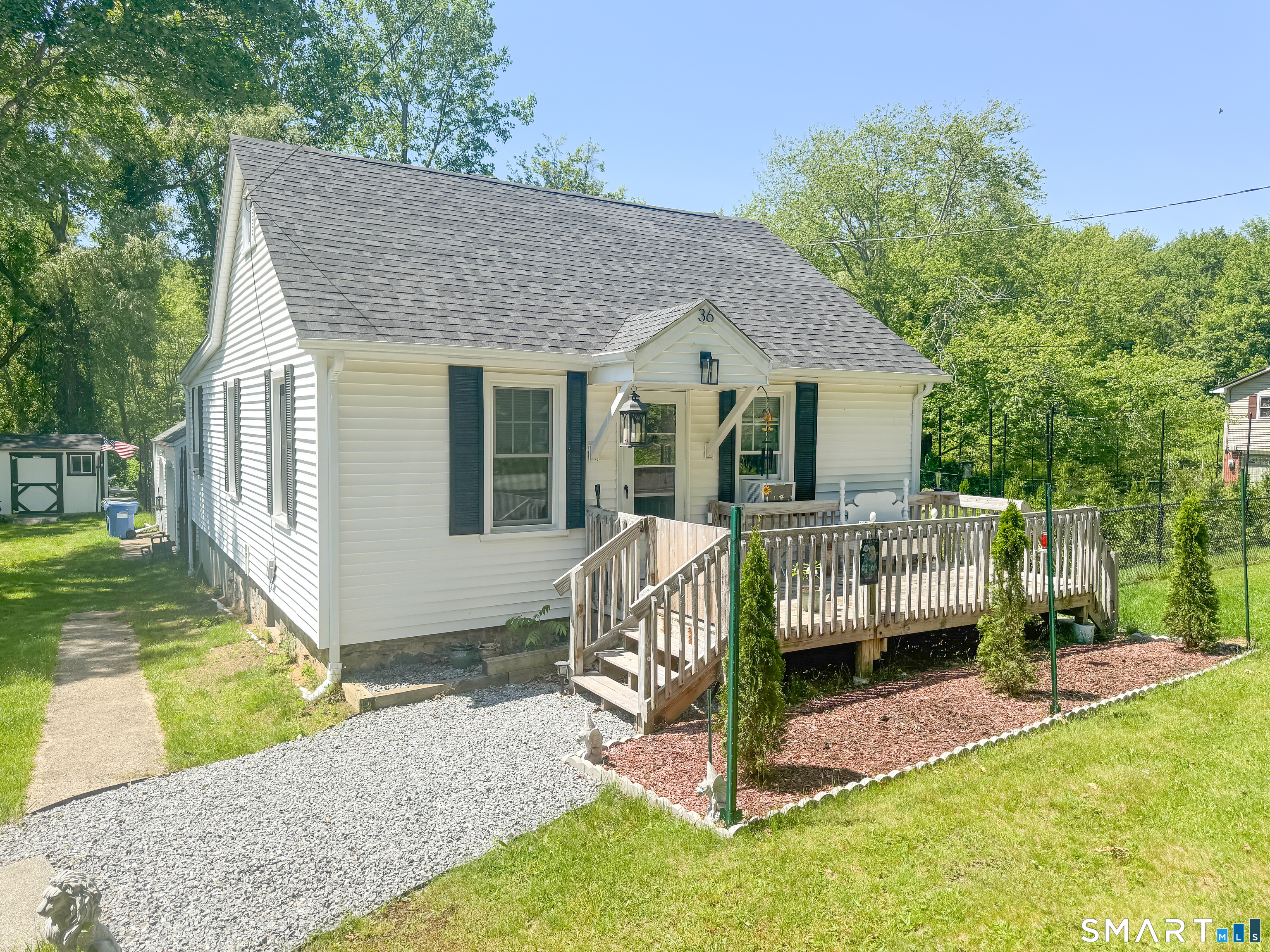 36 Jennings Street Norwich, CT 06360 - Photo 2 of 33 a view of house with a yard chairs and iron fence