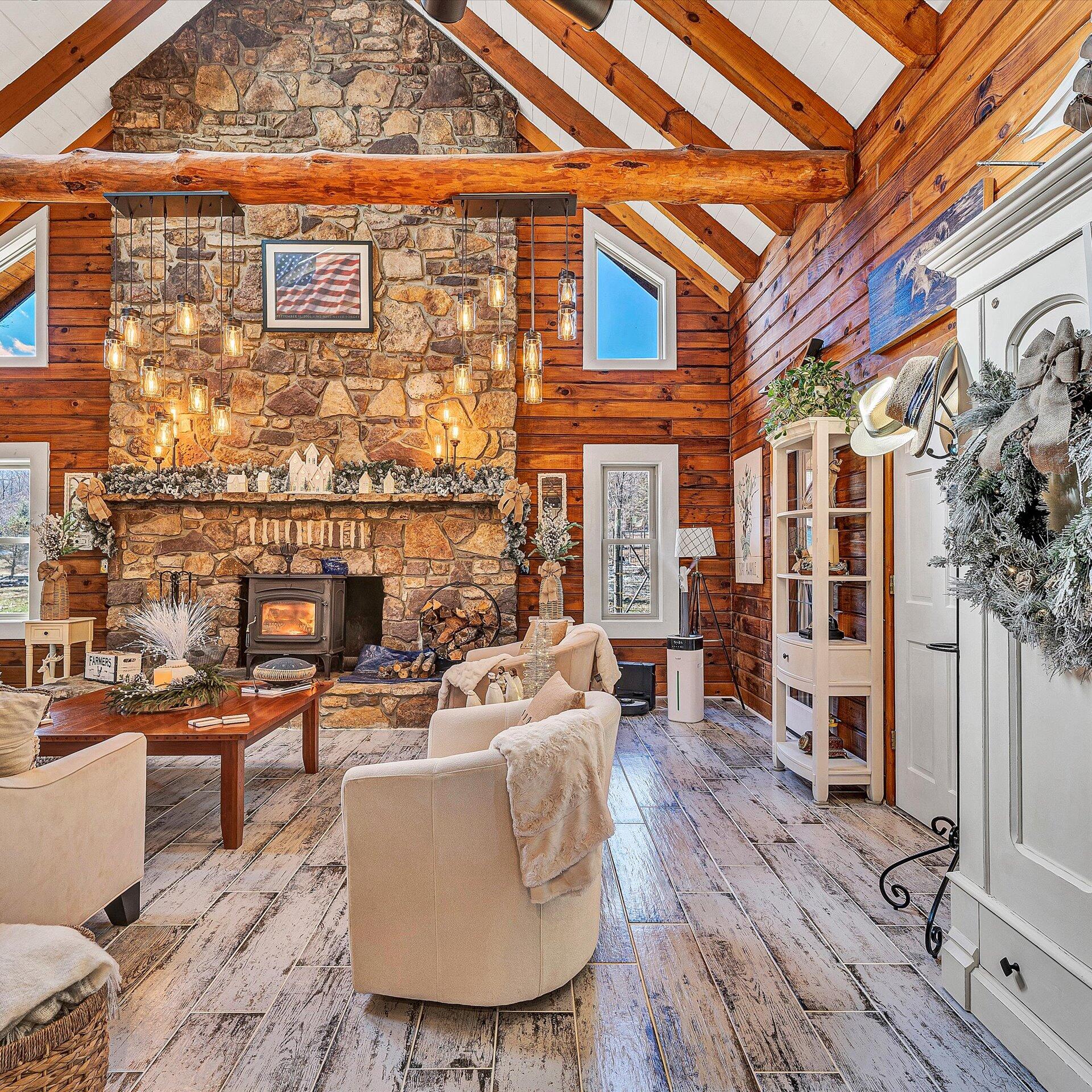 1504 Hutchison Road Newport, VA 24128 - Photo 29 of 99 a living room with fireplace furniture and a wooden floor