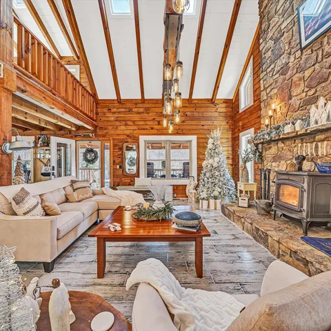 a view of a field of grass and trees