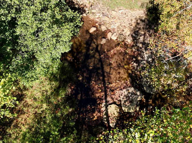 a view of a chairs and table in the patio