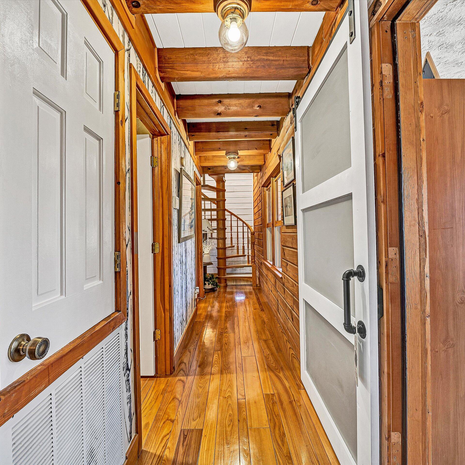 1504 Hutchison Road Newport, VA 24128 - Photo 92 of 99 a view of a hallway with wooden floor and staircase