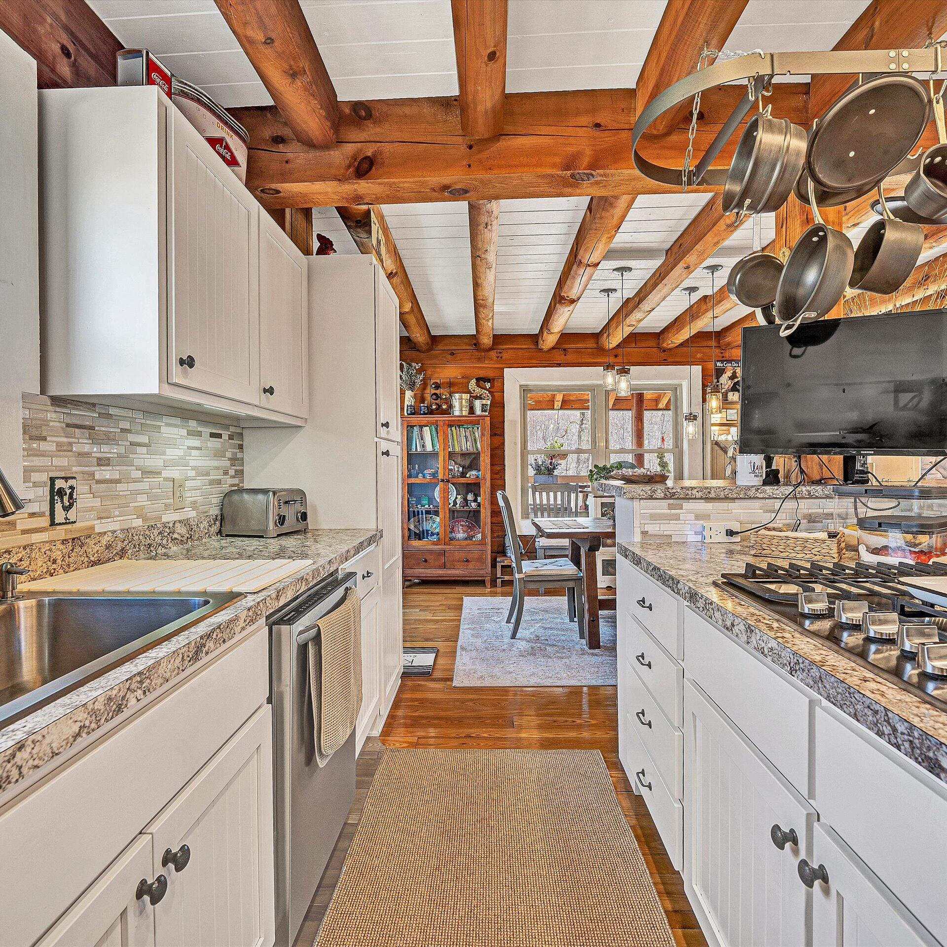1504 Hutchison Road Newport, VA 24128 - Photo 99 of 99 a kitchen with stainless steel appliances granite countertop a sink and cabinets