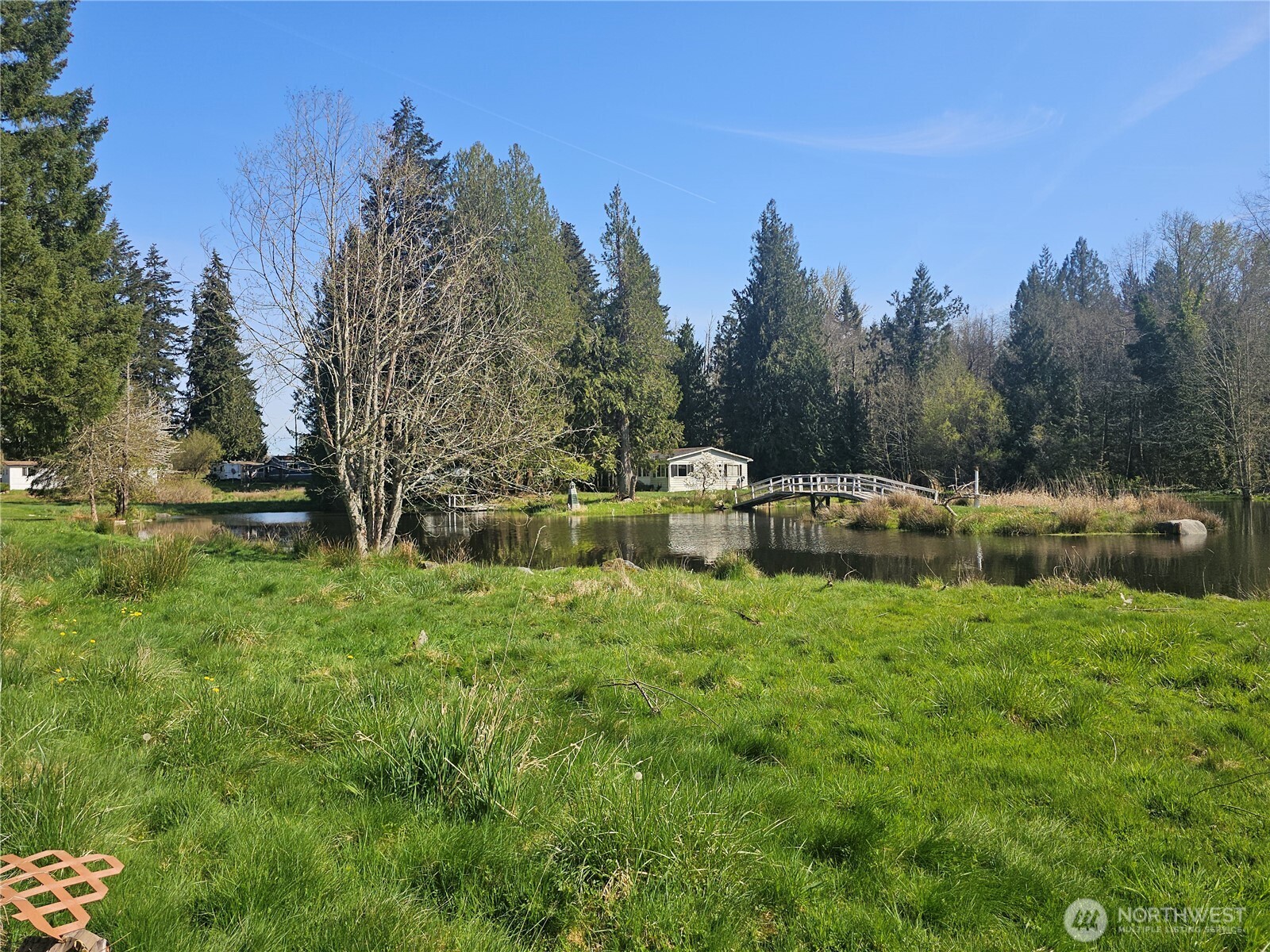 2517 342nd Street South, Unit 12 Roy, WA 98580 - Photo 14 of 16 a backyard of a house with table and chairs