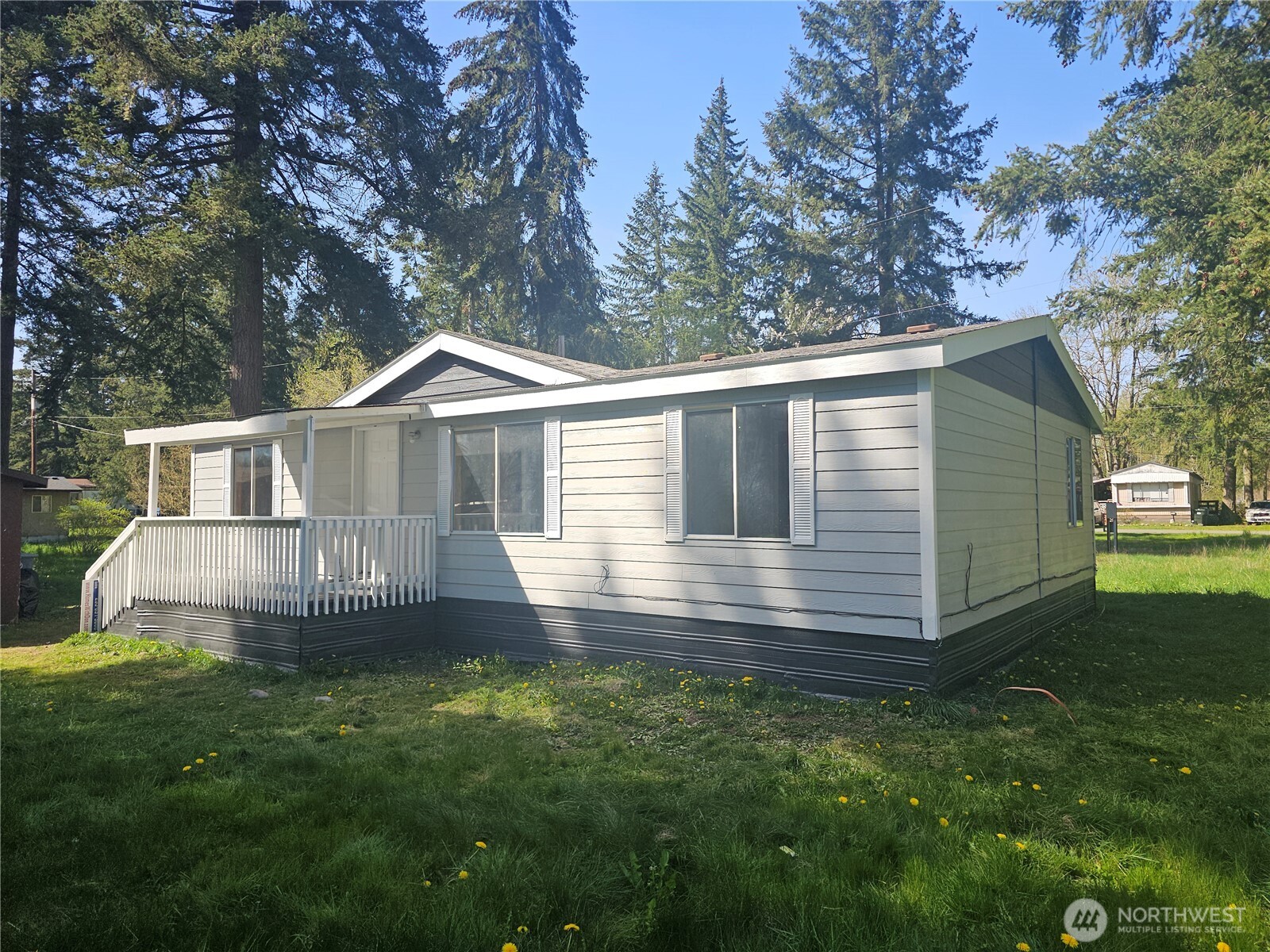 2517 342nd Street South, Unit 12 Roy, WA 98580 - Photo 2 of 16 a front view of a house with a garden