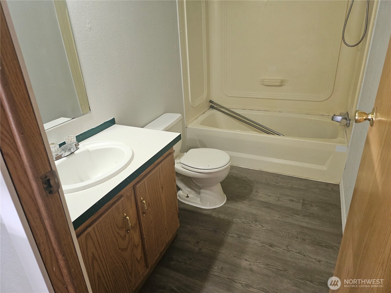 2517 342nd Street South, Unit 12 Roy, WA 98580 - Photo 4 of 16 a bathroom with a sink a toilet and shower