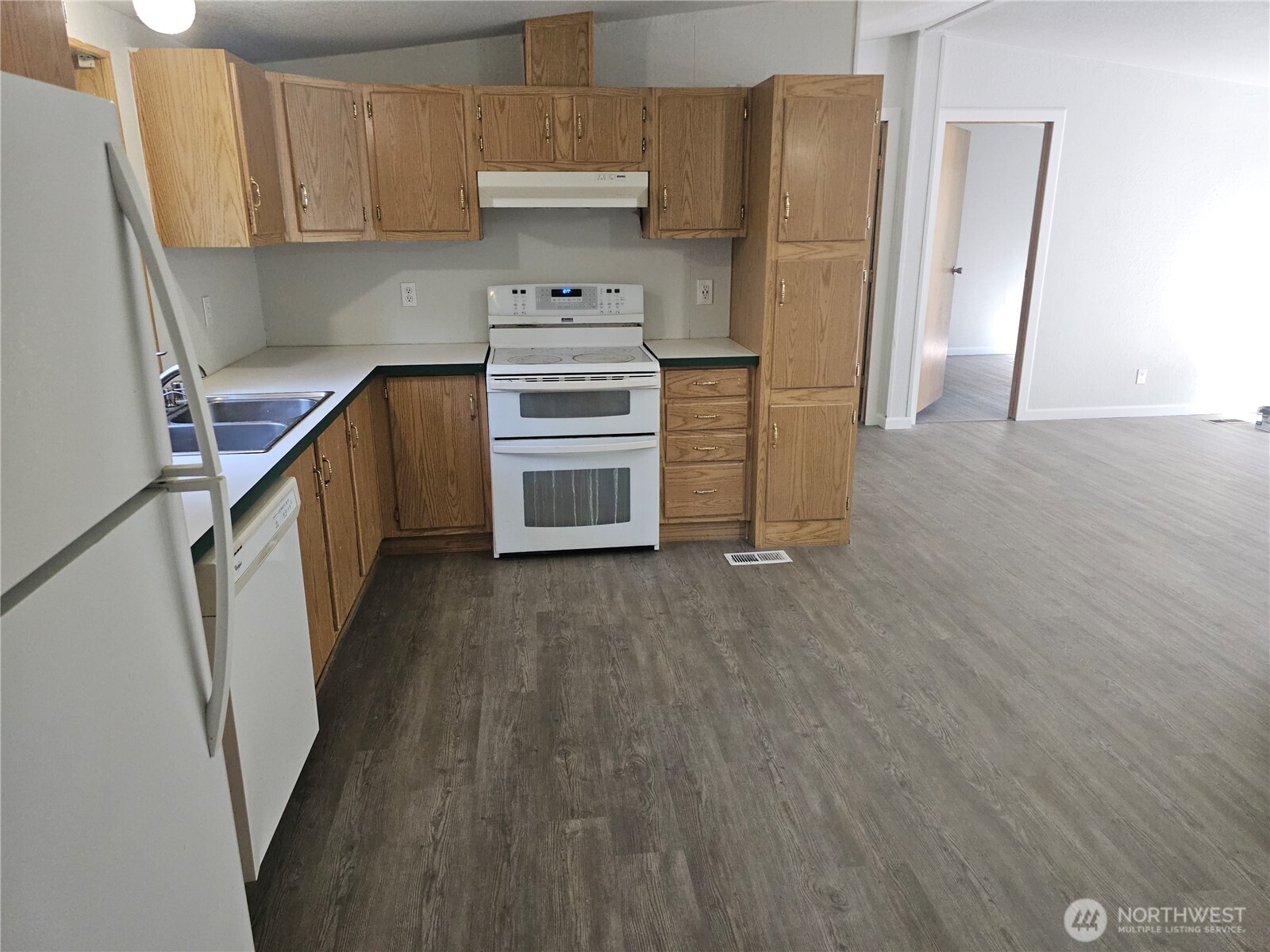 2517 342nd Street South, Unit 12 Roy, WA 98580 - Photo 5 of 16 a kitchen with stainless steel appliances a refrigerator and a stove top oven