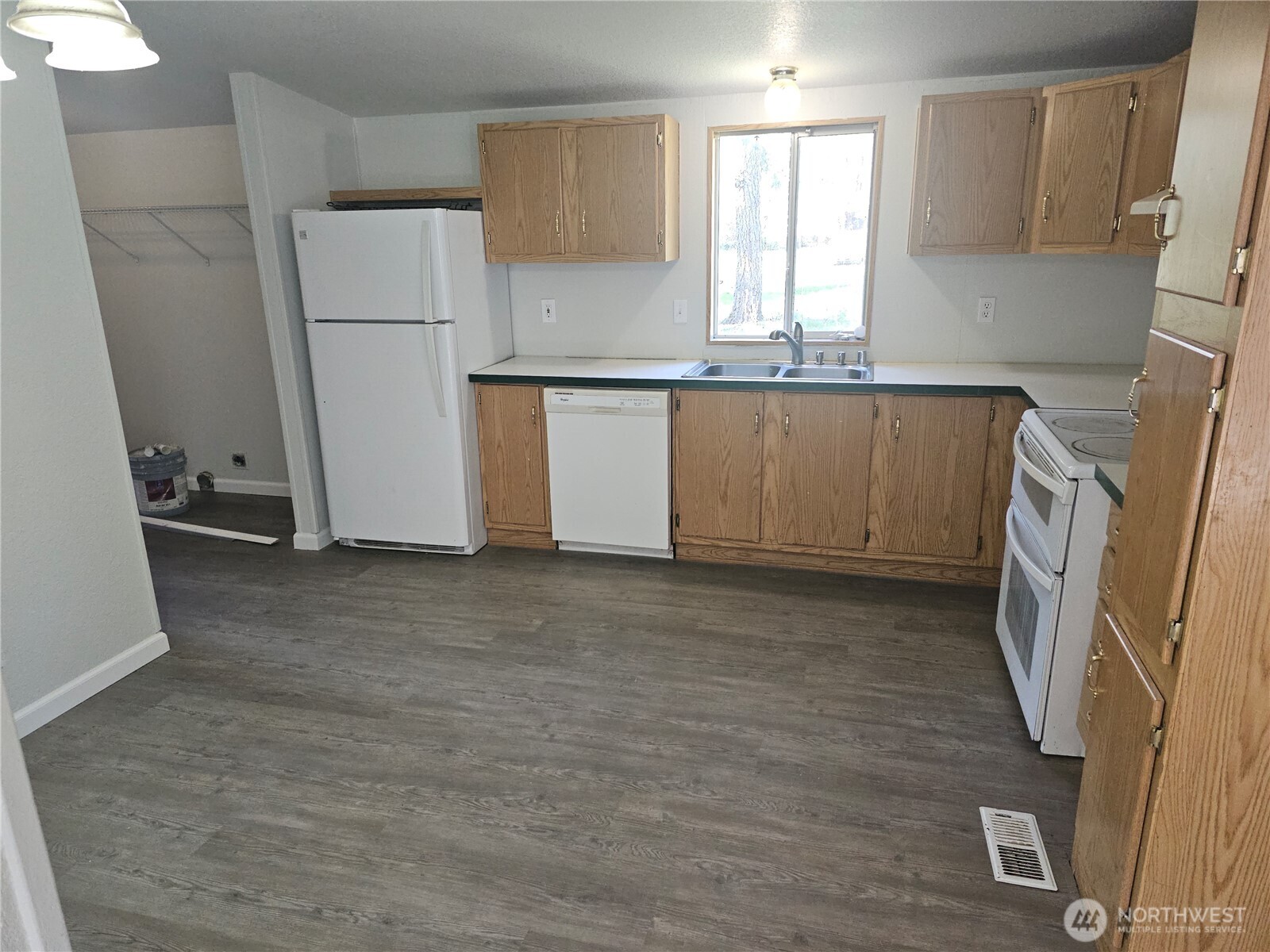 2517 342nd Street South, Unit 12 Roy, WA 98580 - Photo 6 of 16 a kitchen with a refrigerator a washer and dryer