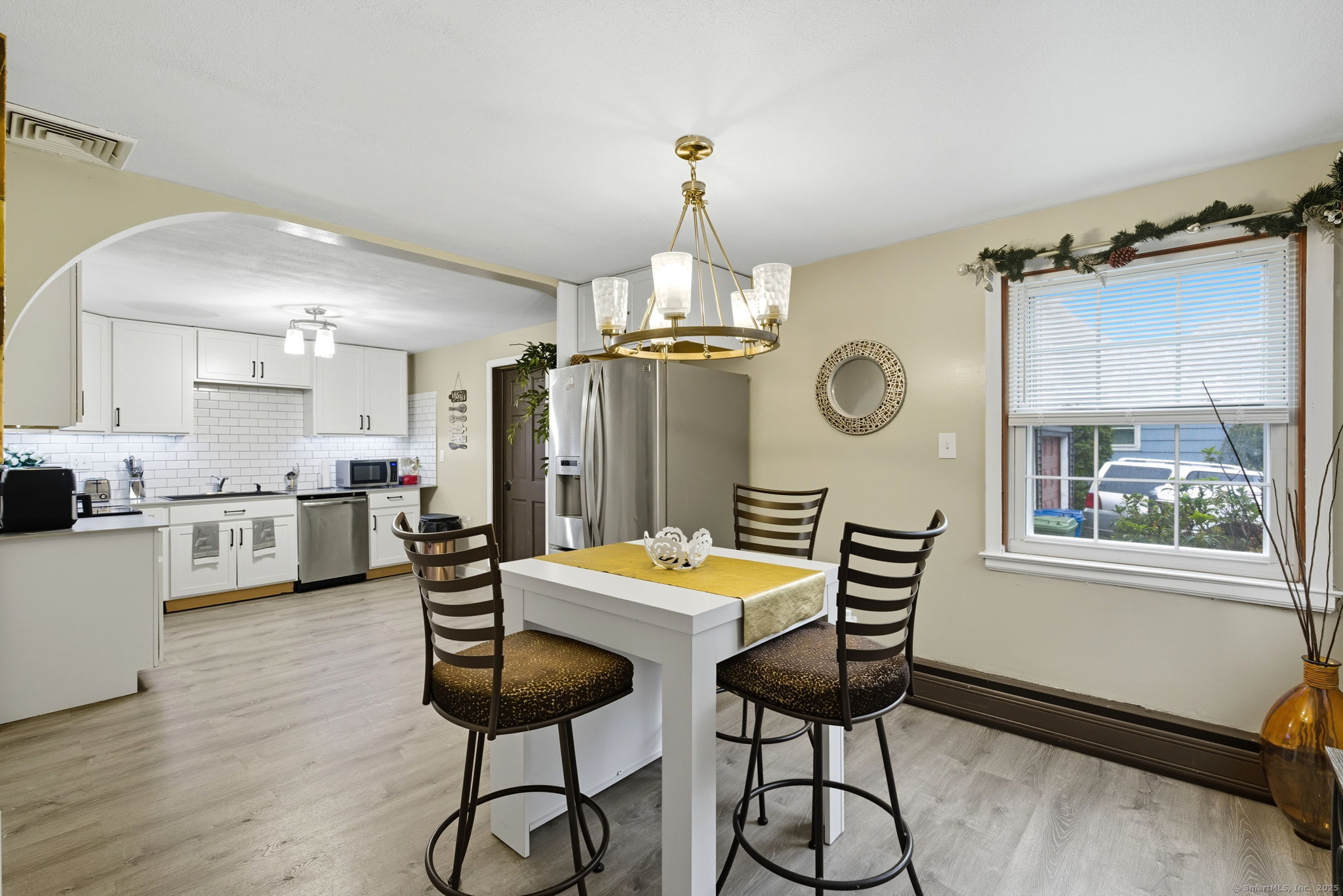41 Chestnut Drive Windsor, CT 06095 - Photo 12 of 27 a kitchen that has a table and chairs in it