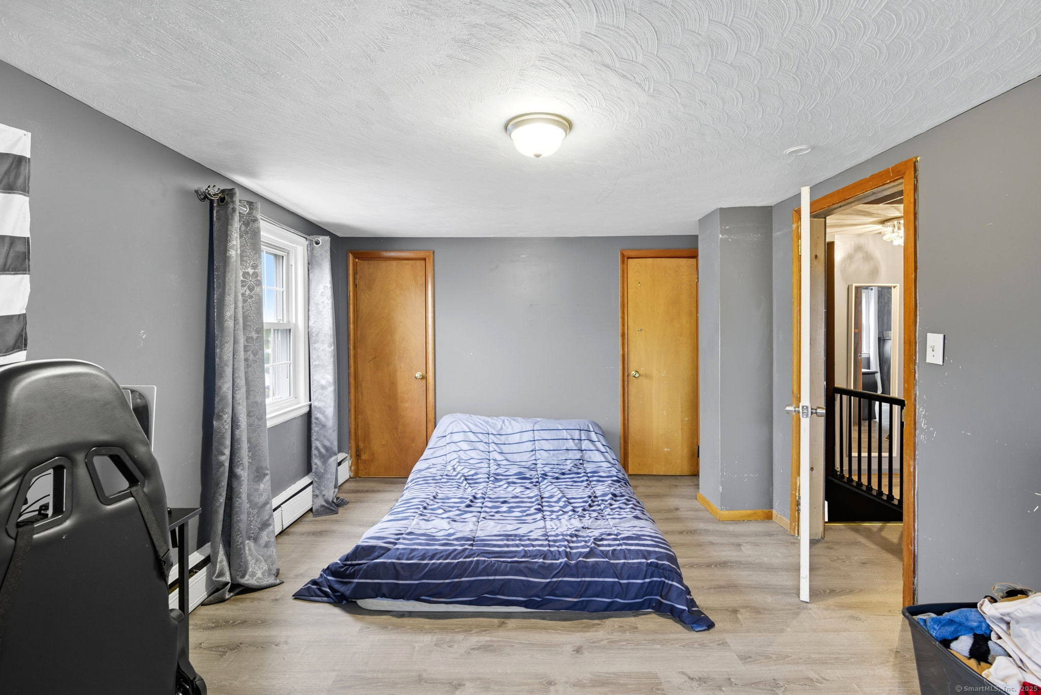41 Chestnut Drive Windsor, CT 06095 - Photo 17 of 27 a living room with furniture and a rug