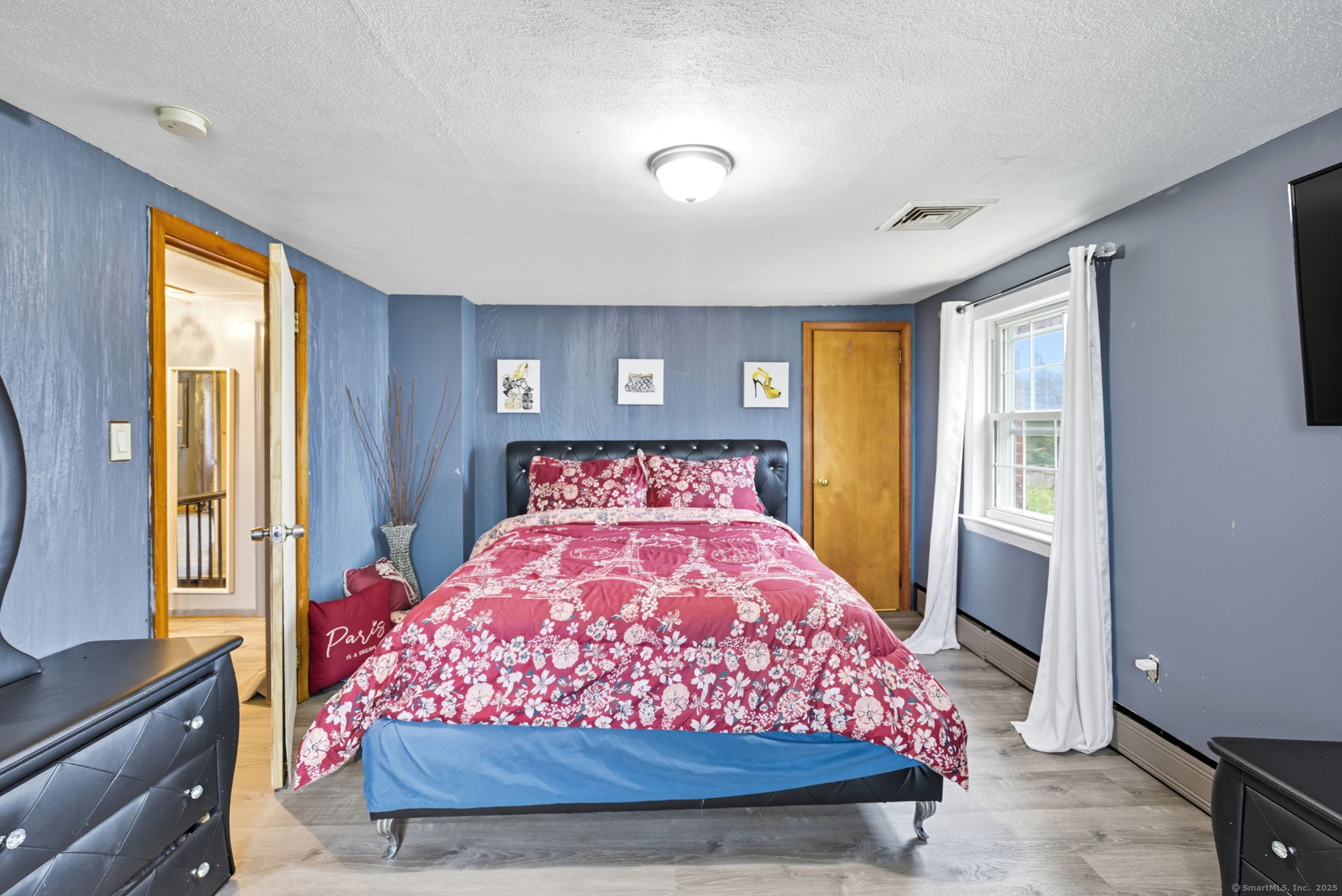 41 Chestnut Drive Windsor, CT 06095 - Photo 18 of 27 a bed sitting in a bedroom next to a window