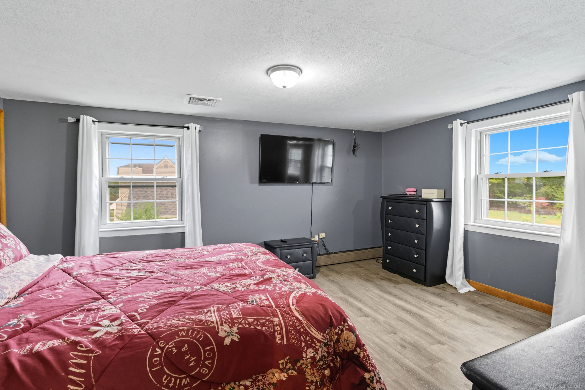 41 Chestnut Drive Windsor, CT 06095 - Photo 20 of 27 a bedroom with a bed and a window