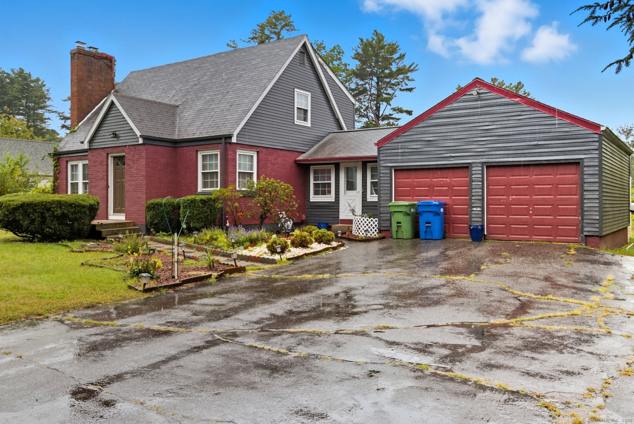 41 Chestnut Drive Windsor, CT 06095 - Photo 2 of 27 a front view of a house with garden
