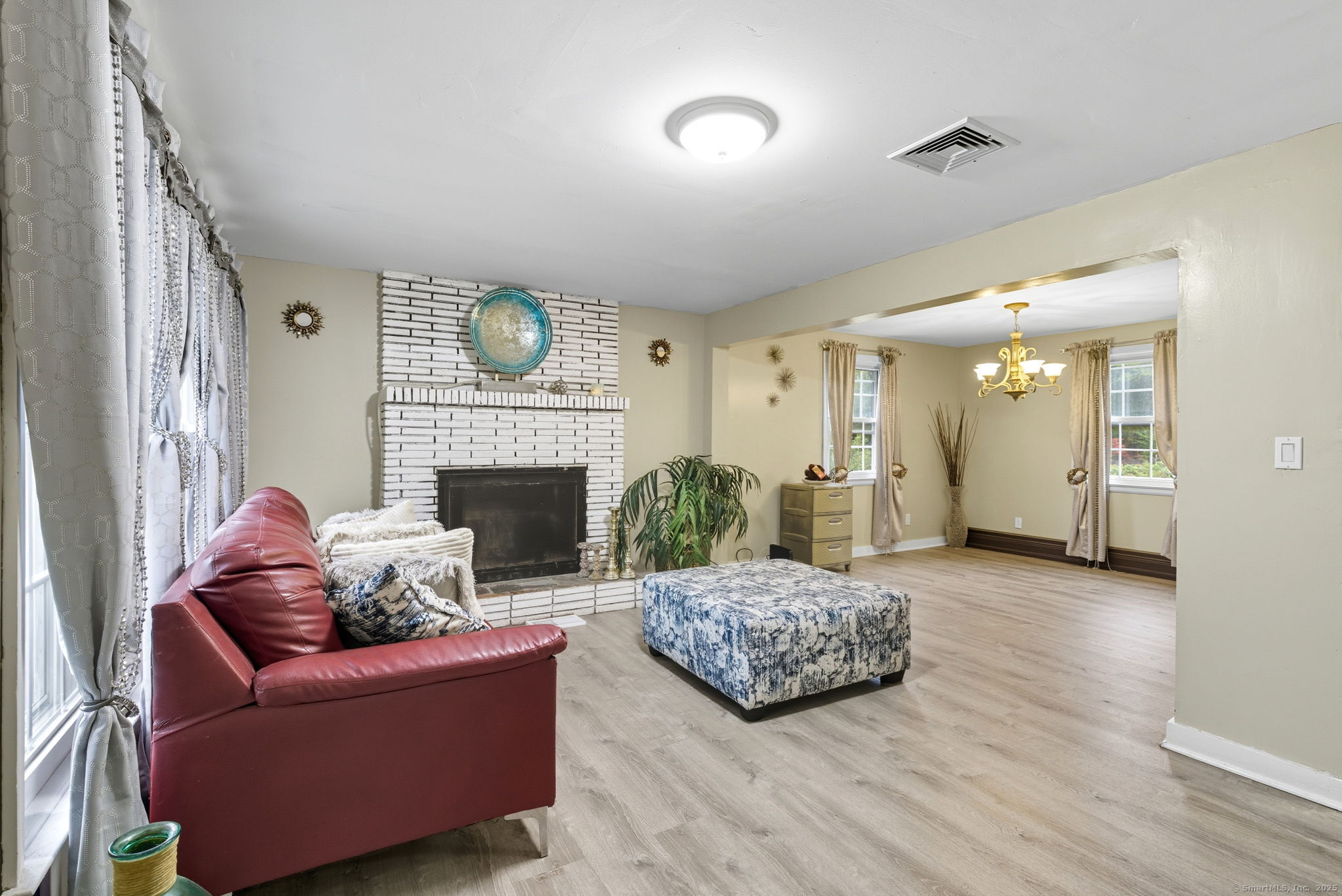 41 Chestnut Drive Windsor, CT 06095 - Photo 3 of 27 a living room with furniture and a fireplace